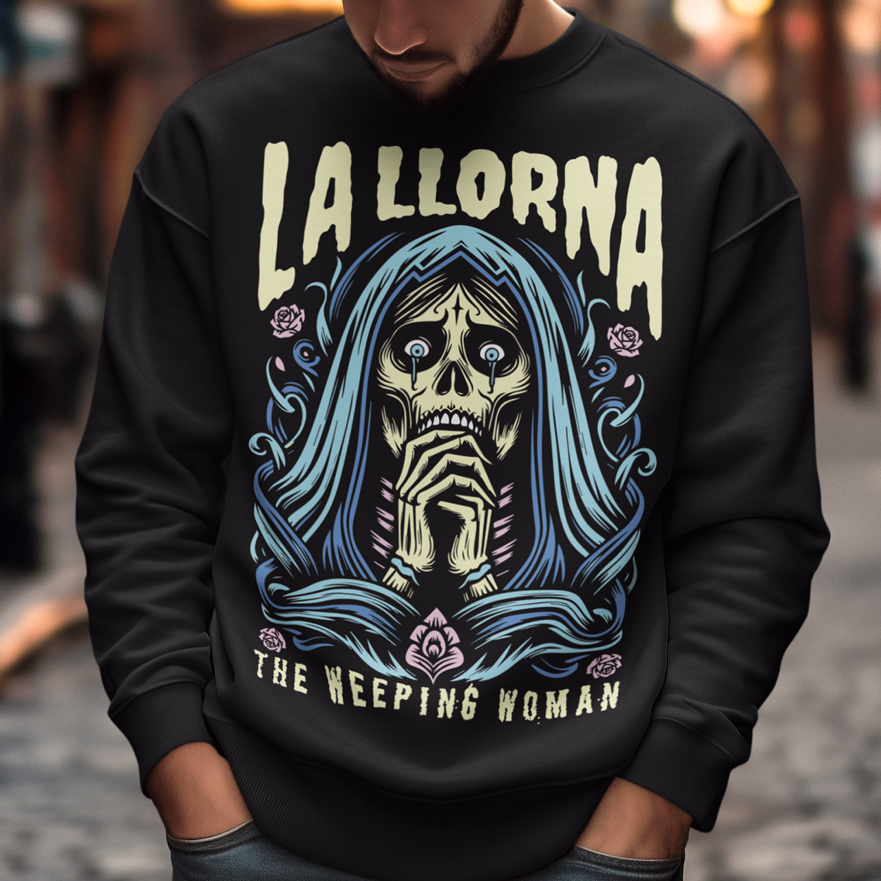 This striking La Llorona sweatshirt features a haunting depiction of the legendary Weeping Woman, her ghostly figure shrouded in mist, with flowing hair and a sorrowful expression as she searches for her lost children. The design captures the eerie, chilling essence of the famous Latin American folktale, blending dark, gothic tones with an ethereal glow. Above the image, bold lettering reads "LA LLORONA", while below, the translation "THE WEEPING WOMAN" adds to the eerie mystique.