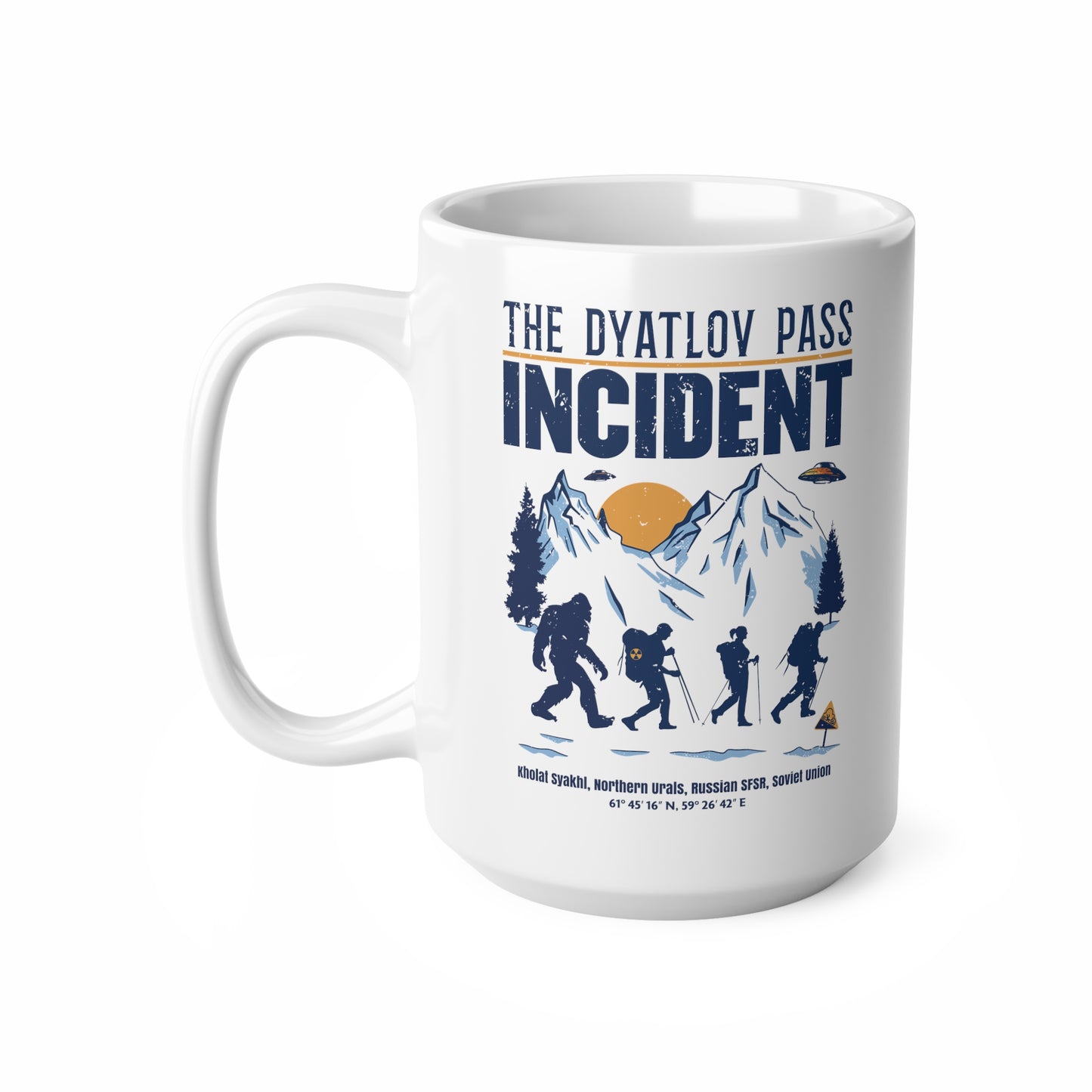 White mug of 3 hikers including Bigfoot in snowy mountains with UFOs and text THE DYATLOV PASS INCIDENT.