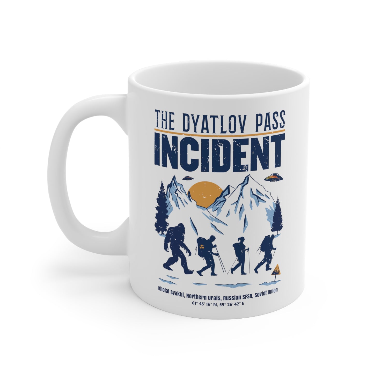White mug of 3 hikers including Bigfoot in snowy mountains with UFOs and text THE DYATLOV PASS INCIDENT.