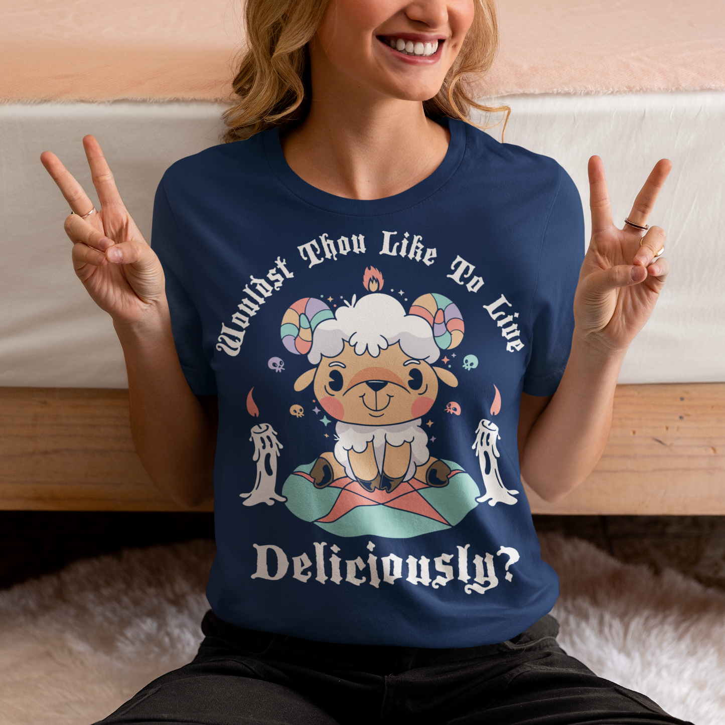 Unleash your inner rebel with this striking graphic tee featuring a smug, mystical goat perched atop a pentagram—summoning vibes as bold as your wardrobe. Inspired by folklore and a hint of witchy sarcasm, the chilling phrase "WOULDST THOU LIKE TO LIVE DELICIOUSLY?" is scrawled across the design in eerie, arcane lettering. Perfect for fans of the occult, dark humor, and aesthetic rebellion.