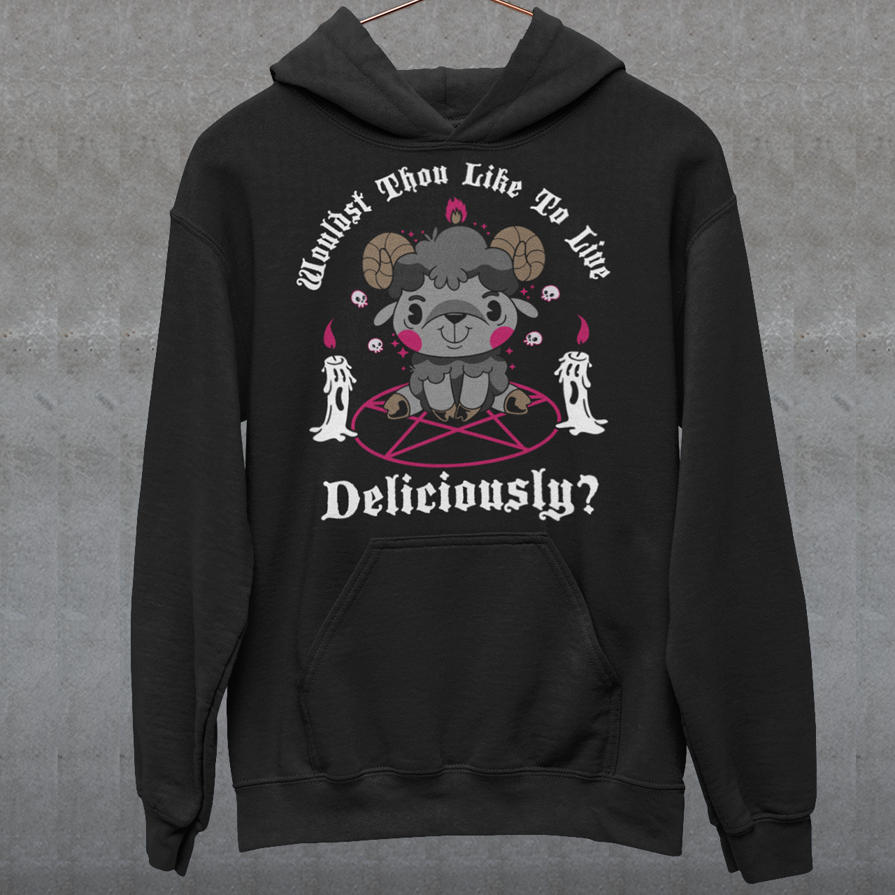 Unleash your inner rebel with this striking graphic hoodie featuring a smug, mystical goat perched atop a pentagram—summoning vibes as bold as your wardrobe. Inspired by folklore and a hint of witchy sarcasm, the chilling phrase "WOULDST THOU LIKE TO LIVE DELICIOUSLY?" is scrawled across the design in eerie, arcane lettering. erfect for fans of the occult, dark humor, and aesthetic rebellion.