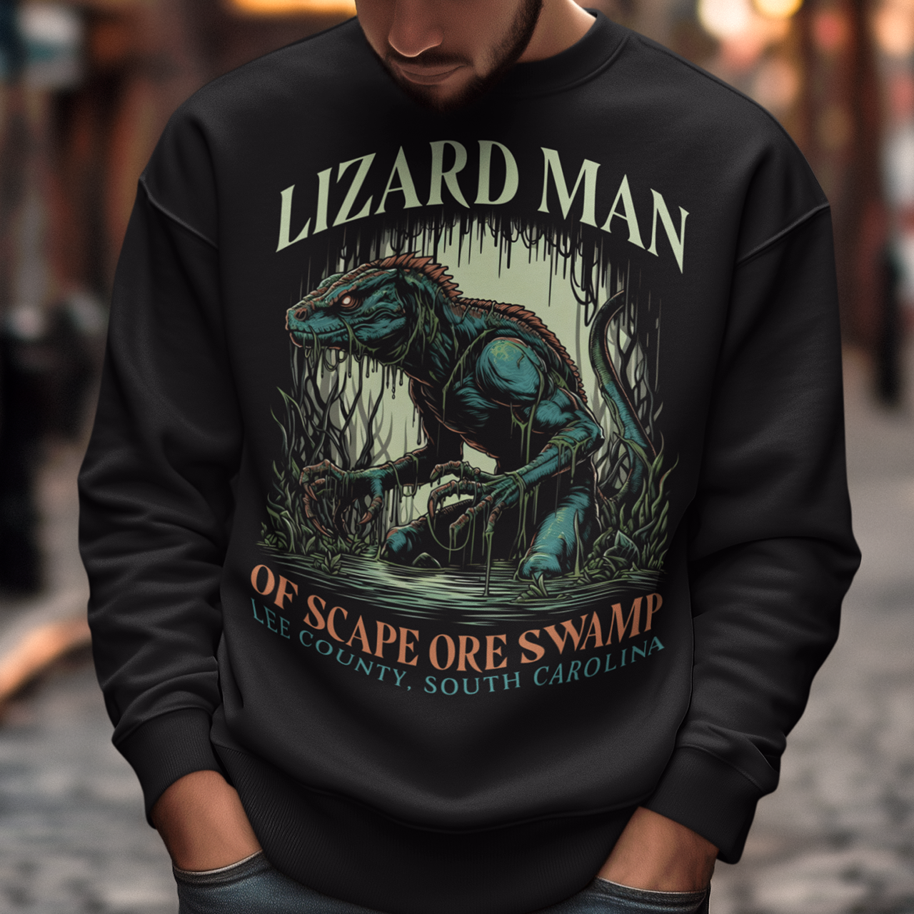 This sweatshirt features a striking design of the legendary "Lizard Man of Scape Ore Swamp." The centerpiece is a menacing yet intriguing lizard man emerging from the murky depths of a swamp, with reptilian scales glistening under the eerie moonlight. The creature's glowing yellow eyes peer out from beneath a rugged brow, and its powerful claws grasp at the twisted roots and moss that surround it.