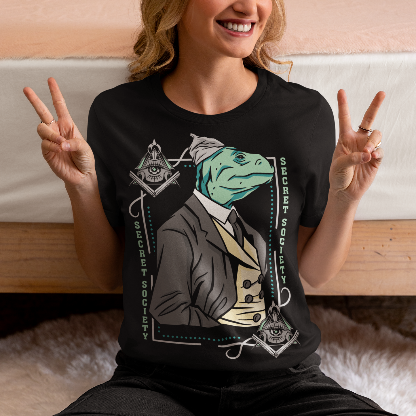 Introducing the enigmatic and captivating "Lizard Illuminati" T-shirt, a bold and eccentric garment that seamlessly blends conspiracy theories with reptilian sophistication. This one-of-a-kind tee is not just a piece of clothing; it's a statement, a conversation starter, and a whimsical nod to the mysteries that lurk in the shadows.