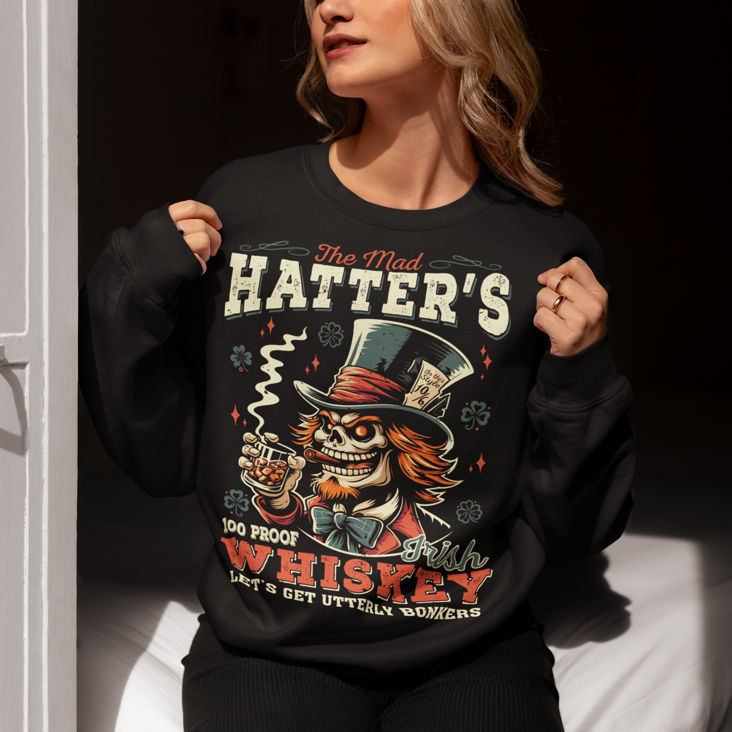 Get ready to add a touch of whimsical madness to your wardrobe with "The Mad Hatter Irish Whiskey" sweatshirt! Inspired by the iconic character from Lewis Carroll's "Alice's Adventures in Wonderland," this shirt features a vibrant illustration of the Mad Hatter, complete with his signature top hat and mischievous grin. With intricate detailing and vivid colors, it captures the essence of Wonderland's eccentric tea party host. Emblazoned across the design is text "THE MAD HATTER IRISH WHISKEY,"