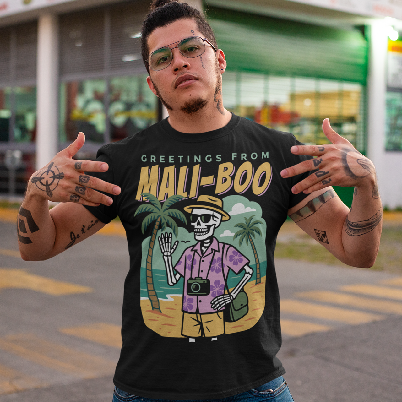 Bring spooky vibes to the sunshine with our “Greetings from Mali-Boo” Skeleton Tee. Featuring a laid-back skeleton kicking back on the beach, this shirt blends Halloween humor with tropical holiday fun. Perfect for anyone who loves a good pun, it’s a playful mash-up of palm trees, sandy shores, and ghostly charm. Lightweight, soft, and eye-catching, this tee is your go-to for summer parties, Halloween hangouts, or just showing off your wicked sense of humor.