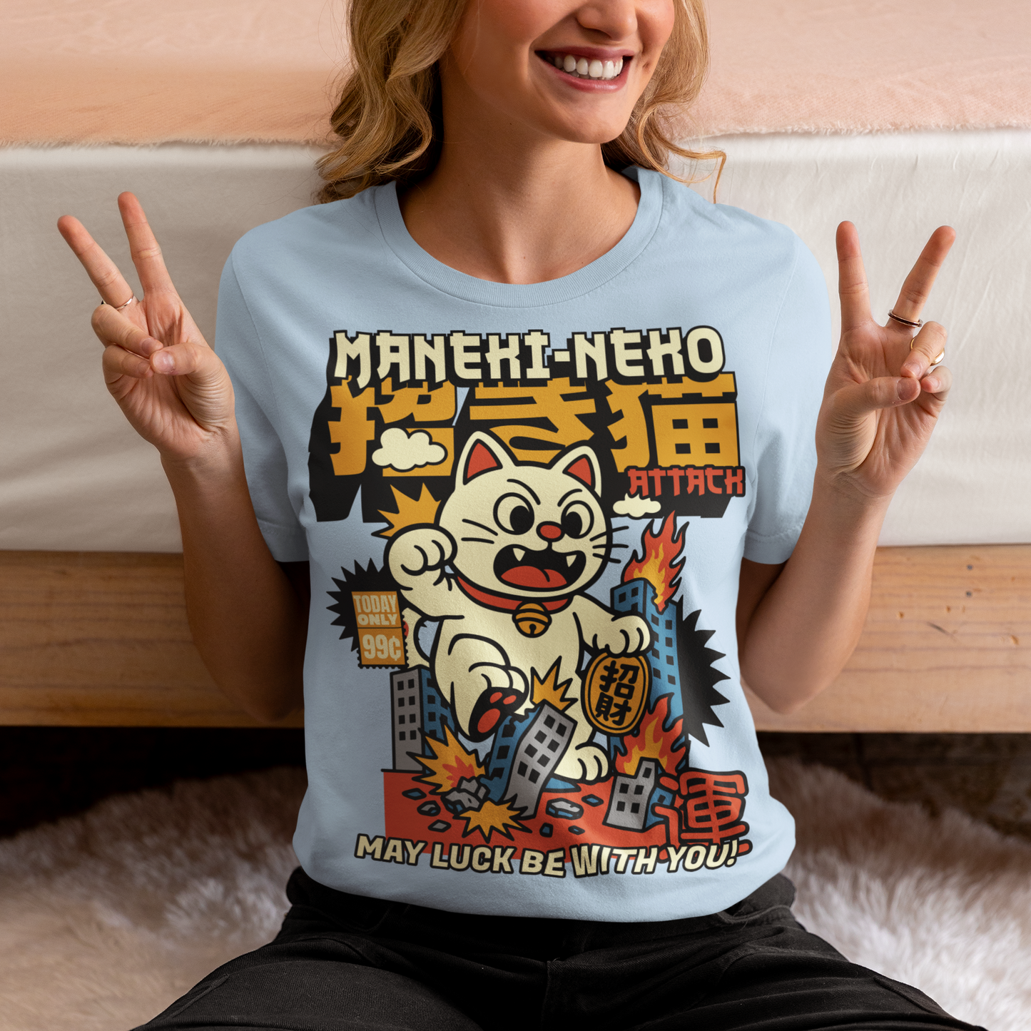 Unleash feline fury with this eye-catching "MANEKI-NEKO ATTACK" t-shirt! Featuring a giant, rampaging Lucky Cat towering over a city skyline, this design puts a wild twist on the traditional symbol of good fortune. With one paw raised and destruction in its wake, the Maneki-Neko trades charm for chaos—smashing buildings while still sporting that iconic golden bell. Bold, stylized lettering screams "MANEKI-NEKO ATTACK" across the top, giving the shirt a retro kaiju-meets-pop-art vibe. Perfect for fans of Jap