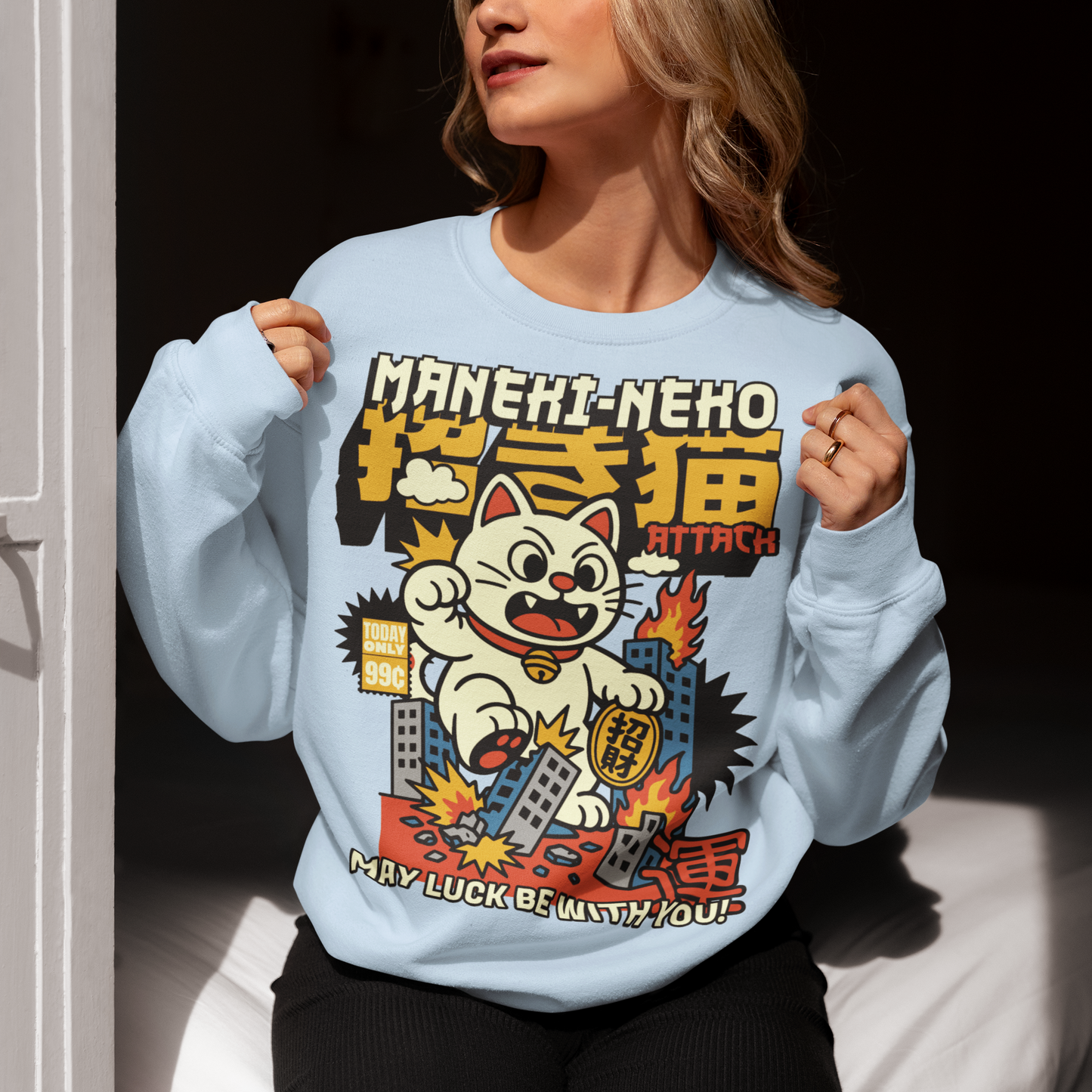 Unleash feline fury with this eye-catching "MANEKI-NEKO ATTACK" sweatshirt! Featuring a giant, rampaging Lucky Cat towering over a city skyline, this design puts a wild twist on the traditional symbol of good fortune. With one paw raised and destruction in its wake, the Maneki-Neko trades charm for chaos—smashing buildings while still sporting that iconic golden bell. Bold, stylized lettering screams "MANEKI-NEKO ATTACK" across the top, giving the shirt a retro kaiju-meets-pop-art vibe.