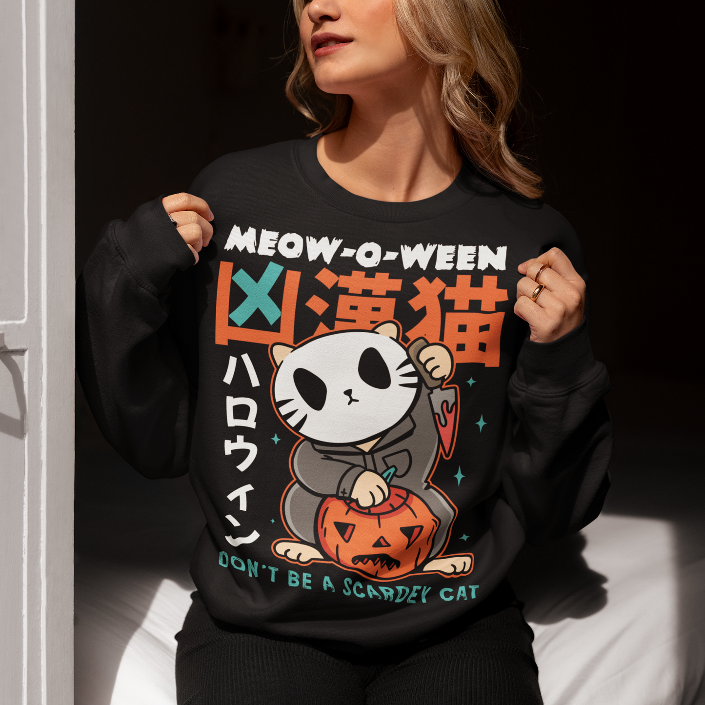 Unleash spooky-cute vibes with our Japanese Horror Cat Sweatshirt! Featuring a chilling yet playful design, this shirt showcases a wide-eyed, horror cat inspired by Japanese art styles. Above the cat, bold text reads “MEOW-O-WEEN”, while below it warns “DON’T BE A SCAREDY CAT”—perfect for Halloween lovers with a dark sense of humor. Made from soft, breathable cotton, this shirt is ideal for parties, trick-or-treating, or just showing off your love for horror and cats all year round.