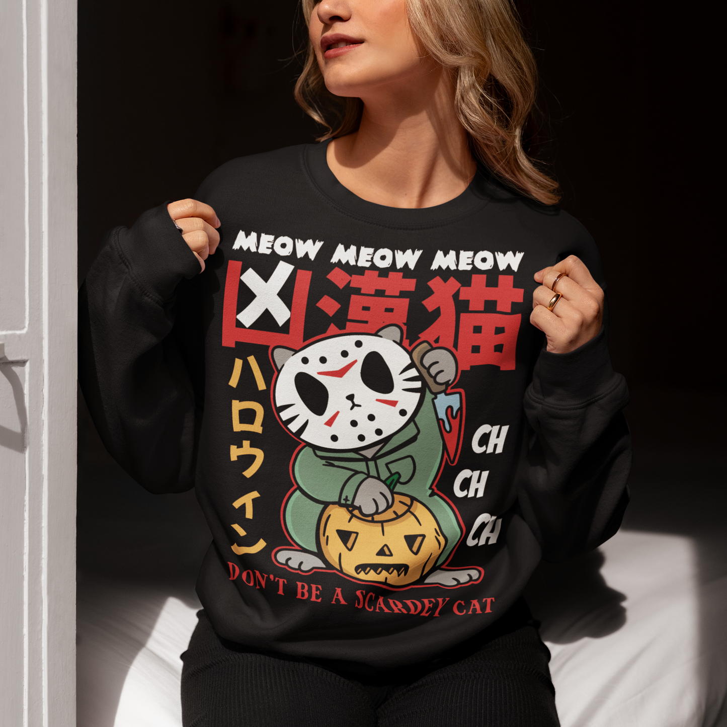 Unleash spooky-cute vibes with our Japanese Horror Cat Sweatshirt! Featuring a chilling yet playful design, this shirt showcases a wide-eyed, horror cat inspired by Japanese art styles. Above the cat, bold text reads “MEOW MEOW MEOW CH CH CH”, while below it warns “DON’T BE A SCAREDY CAT”—perfect for Halloween lovers with a dark sense of humor. Made from soft, breathable cotton, this shirt is ideal for parties, trick-or-treating, or just showing off your love for horror and cats all year round.