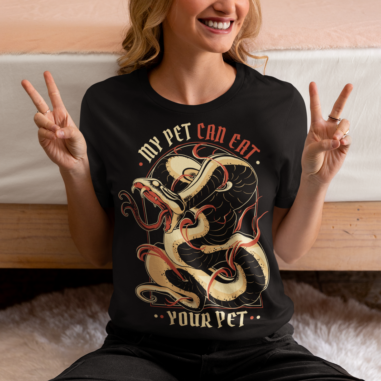Introducing our edgy and eye-catching t-shirt, where the wild meets the witty: the "MY PET CAN EAT YOUR PET" design. This captivating piece effortlessly combines a striking image of a sinuous and intricately detailed snake with a bold proclamation that's sure to turn heads. At the heart of the design is an incredibly lifelike depiction of a snake, coiled and ready to strike. The artistry and attention to detail showcase every scale, curve, and menacing gaze of this magnificent creature.