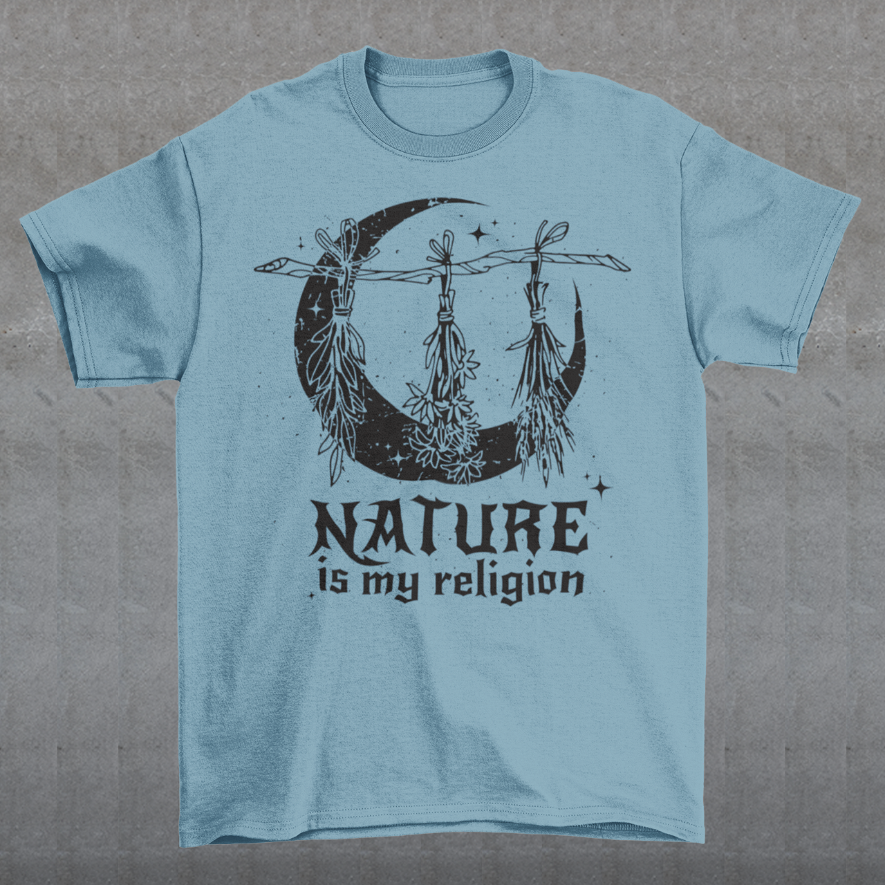 This t-shirt features a stunning and eye-catching design that is sure to grab attention wherever you go. The front of the shirt boldly displays the phrase "Nature is my religion" in bold, striking lettering. The message is a powerful statement that reflects a deep connection and reverence for the natural world. The moon, depicted in intricate detail, adds an extra layer of symbolism to the design.