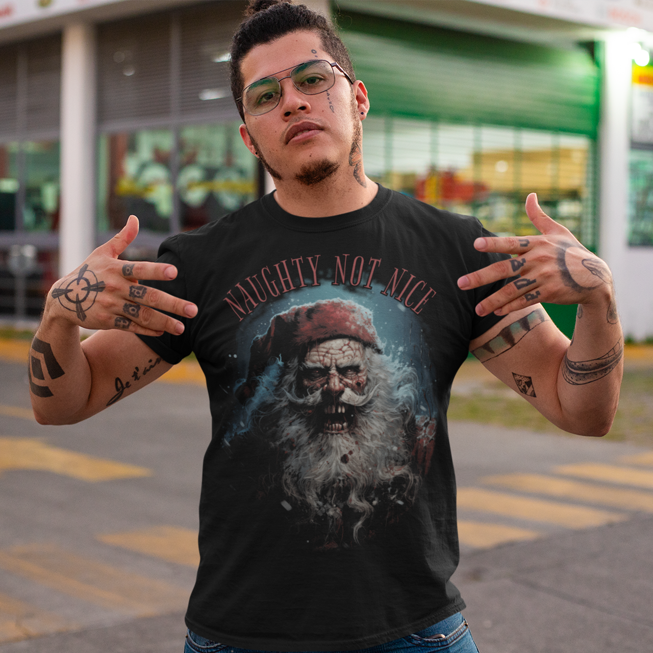 Black christmas t-shirt of a scary santa with text "NAUGHTY NOT NICE".