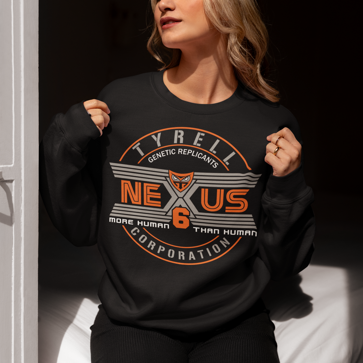 Step into the dystopian future with this sleek Nexus Tyrell Corporation sweatshirt, inspired by the iconic Blade Runner universe. Featuring the legendary Tyrell logo and bold "Nexus" branding, this shirt pays homage to the megacorp behind the world's most advanced replicants. This shirt is perfect for fans of cyberpunk, sci-fi, or anyone drawn to the blurred lines between human and machine.