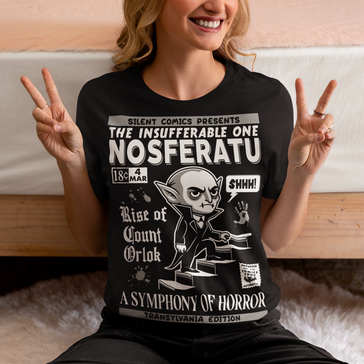Unleash the eerie allure of classic horror with this Nosferatu comic book cover t-shirt! The design features a stunning vintage-style comic book rendition of the iconic vampire, Count Orlok, emerging from the shadows. Perfect for fans of classic horror, retro comics, and timeless gothic vibes, this t-shirt is a wearable piece of cinematic and artistic history.