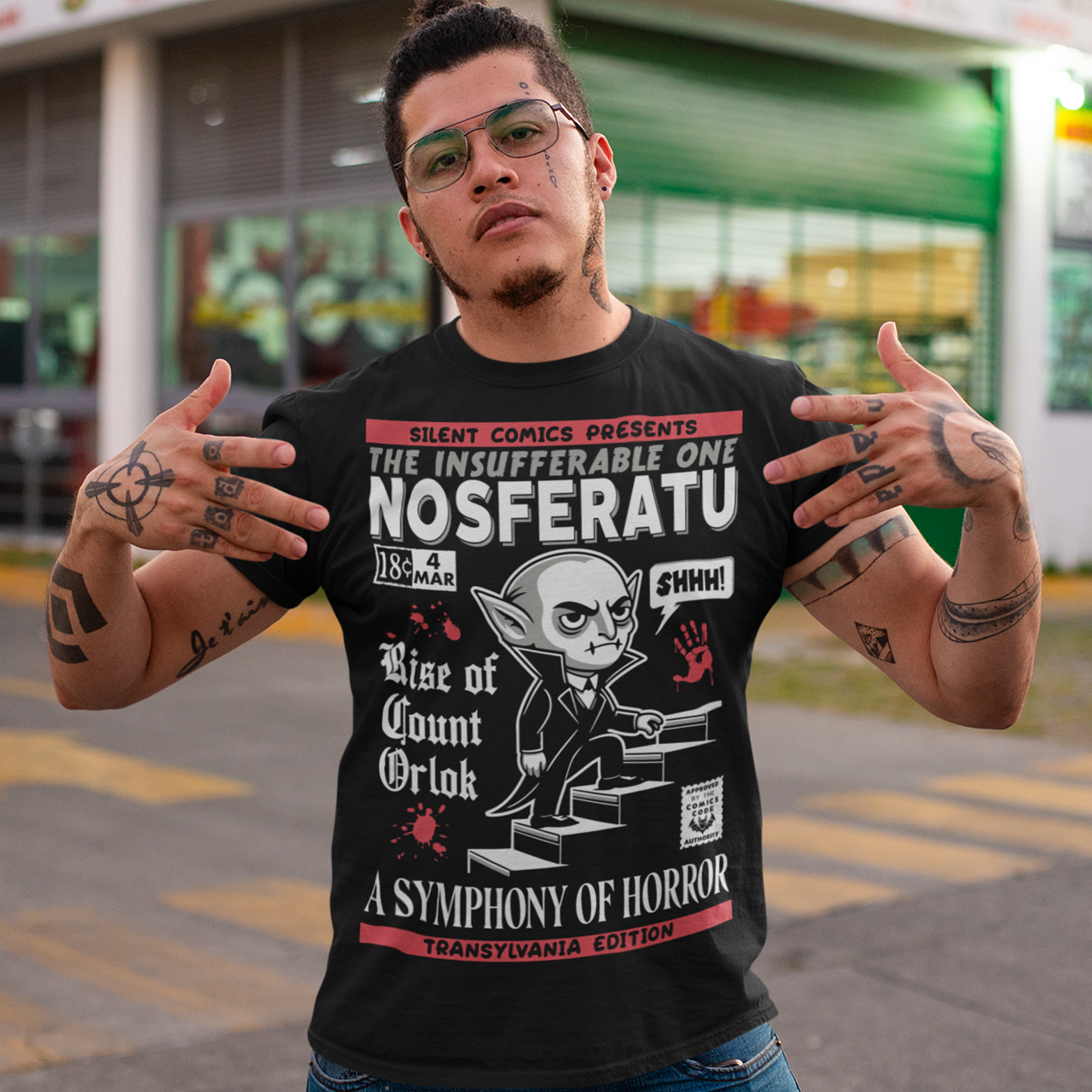 Unleash the eerie allure of classic horror with this Nosferatu comic book cover t-shirt! The design features a stunning vintage-style comic book rendition of the iconic vampire, Count Orlok, emerging from the shadows. Perfect for fans of classic horror, retro comics, and timeless gothic vibes, this t-shirt is a wearable piece of cinematic and artistic history.