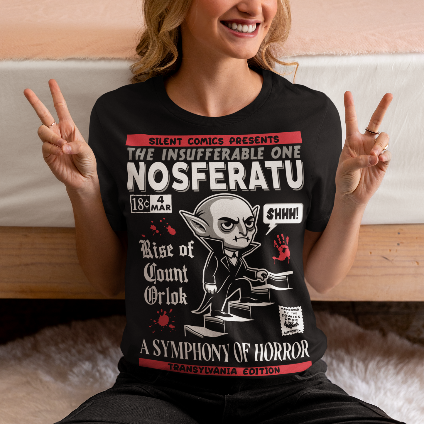 Unleash the eerie allure of classic horror with this Nosferatu comic book cover t-shirt! The design features a stunning vintage-style comic book rendition of the iconic vampire, Count Orlok, emerging from the shadows. Perfect for fans of classic horror, retro comics, and timeless gothic vibes, this t-shirt is a wearable piece of cinematic and artistic history.