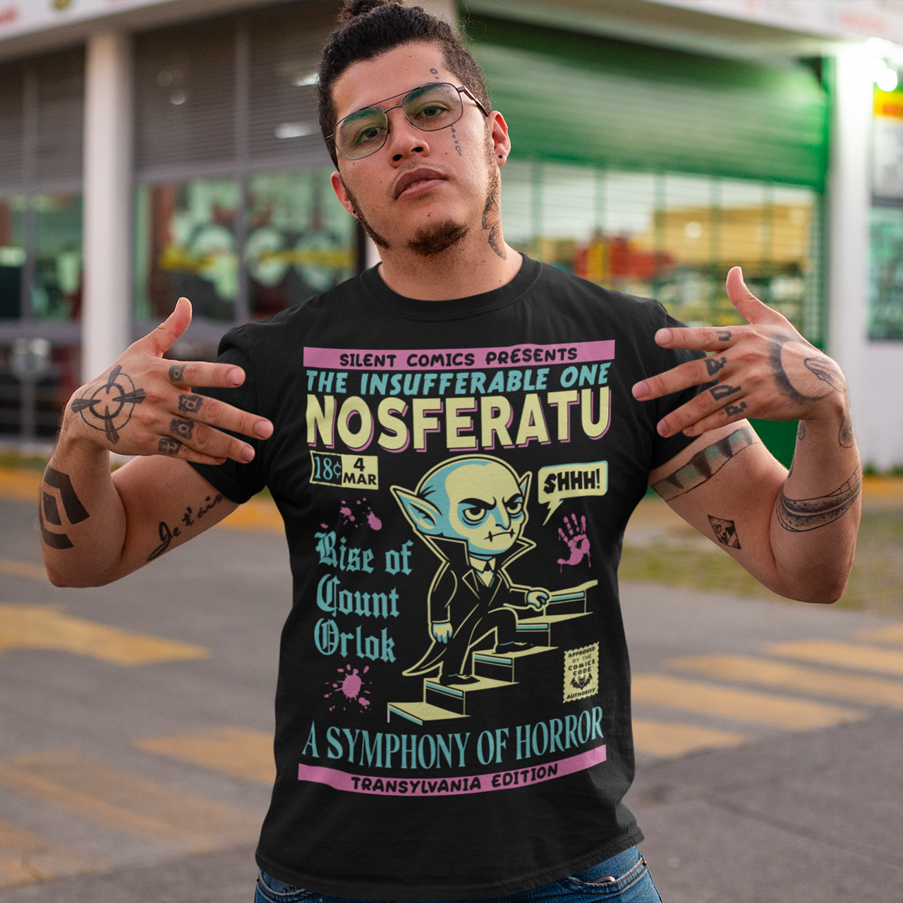 Unleash the eerie allure of classic horror with this Nosferatu comic book cover t-shirt! The design features a stunning vintage-style comic book rendition of the iconic vampire, Count Orlok, emerging from the shadows. Perfect for fans of classic horror, retro comics, and timeless gothic vibes, this t-shirt is a wearable piece of cinematic and artistic history.