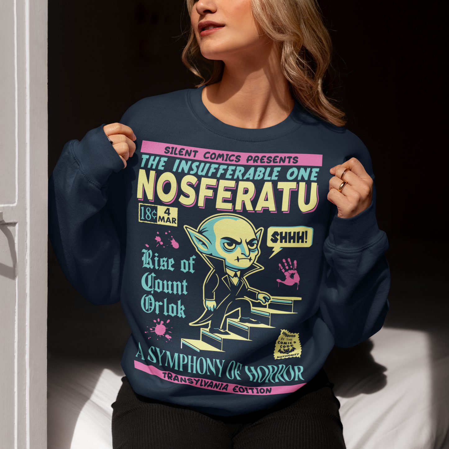 Navy sweatshirt of a comic book cover of Nosferatu. A symphony of horror.