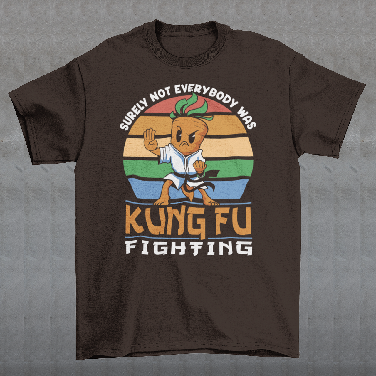 Introducing our vibrant and whimsical "Kung Fu Carrot" T-shirt, a perfect blend of humor and retro flair that's sure to turn heads! This unique design features a fearless carrot assuming a kung fu stance against the backdrop of a mesmerizing retro sun. The carrot's determined expression and martial arts pose exude confidence and playfulness. Surrounding this dynamic scene is the iconic phrase "SURELY NOT EVERYBODY WAS KUNG FU FIGHTING,".