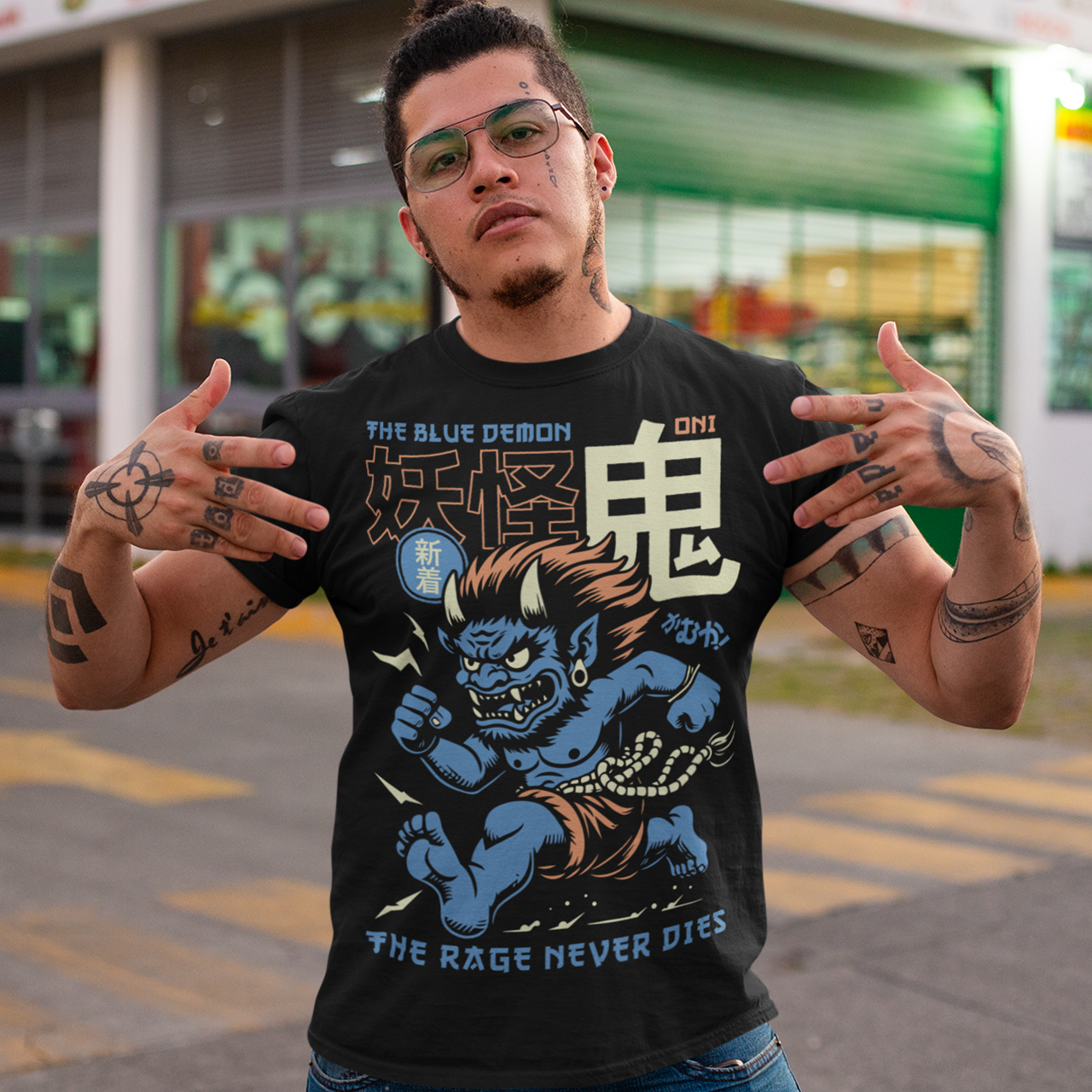 Bold, fierce, and unstoppable — this dynamic tee features a powerful Japanese Oni mid-sprint, eyes blazing and muscles tense with fury. Above the image, bold text declares "THE BLUE DEMON", while below, a chilling reminder reads: "THE RAGE NEVER DIES". This shirt captures the raw energy and mythic wrath of the Oni spirit — perfect for those who embrace intensity and never back down.