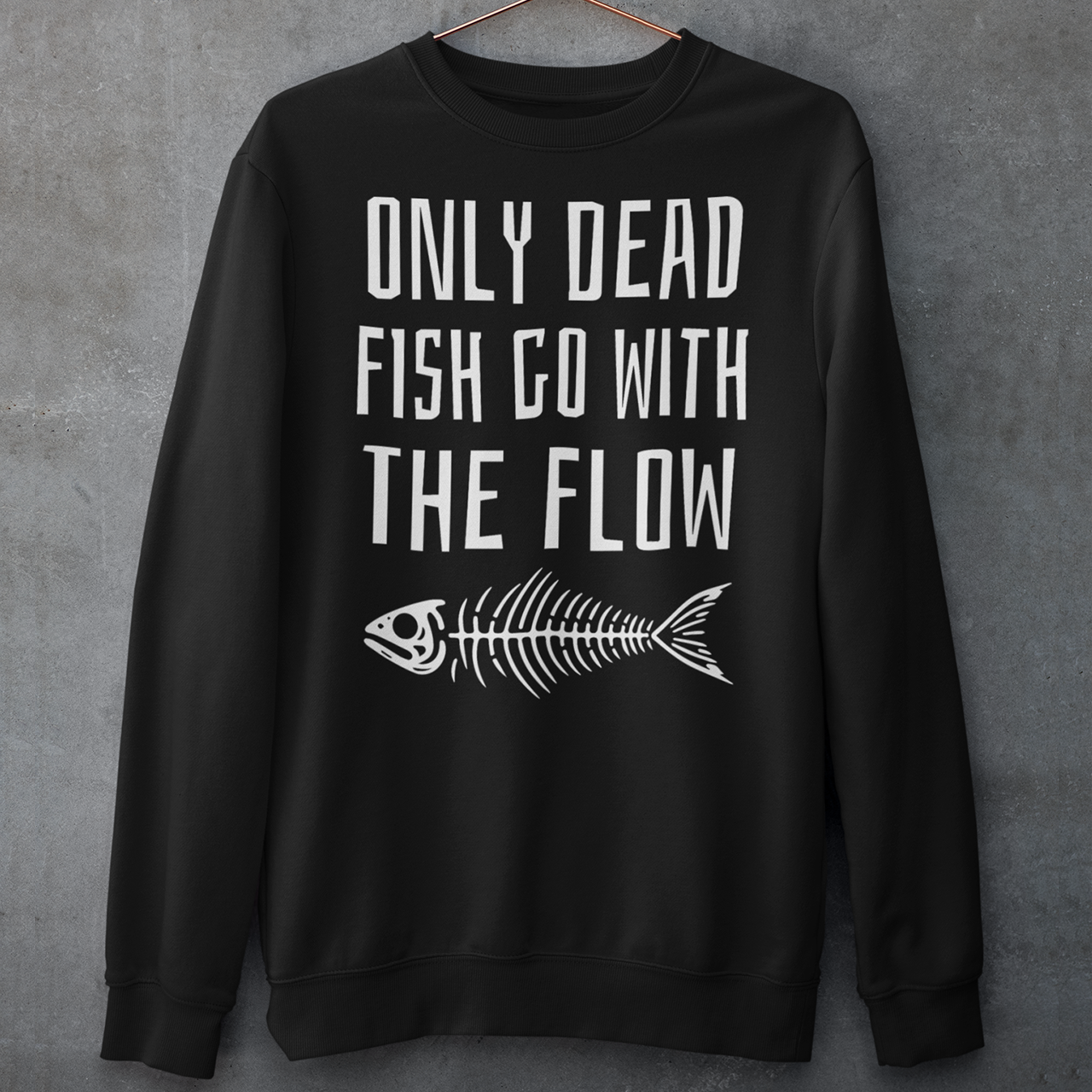 Introducing our bold and thought-provoking sweatshirt that features a striking design: a fish skeleton, paired with the empowering message "ONLY DEAD FISH GO WITH THE FLOW." This sweatshirt is perfect for those who pride themselves on swimming against the tide and embracing their individuality. The fish skeleton, rendered in a minimalist yet impactful style, symbolizes the importance of standing out and making your own path.