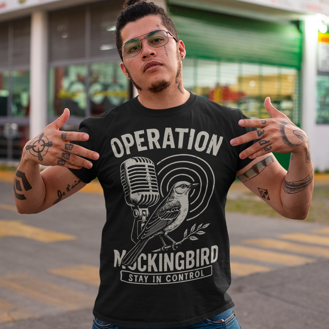 Celebrate a fascinating piece of Cold War history with this Operation Mockingbird tee. Featuring a sleek graphic of a mockingbird perched on a microphone, the design nods to the program that sought to influence news media during the mid-20th century. Perfect for history enthusiasts, political science buffs, and anyone who loves thought-provoking apparel.