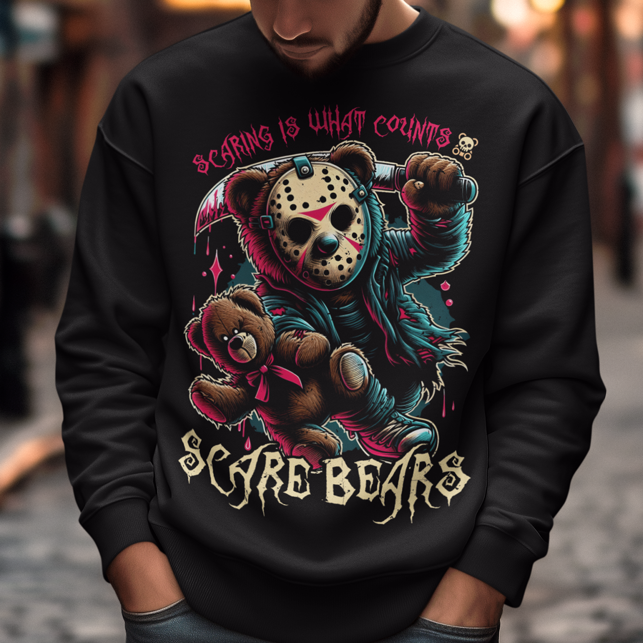 Black sweatshirt of a bear with a hockey mask and machete with text above "SCARING IS WHAT COUNTS". "Text below "SCARE BEARS".