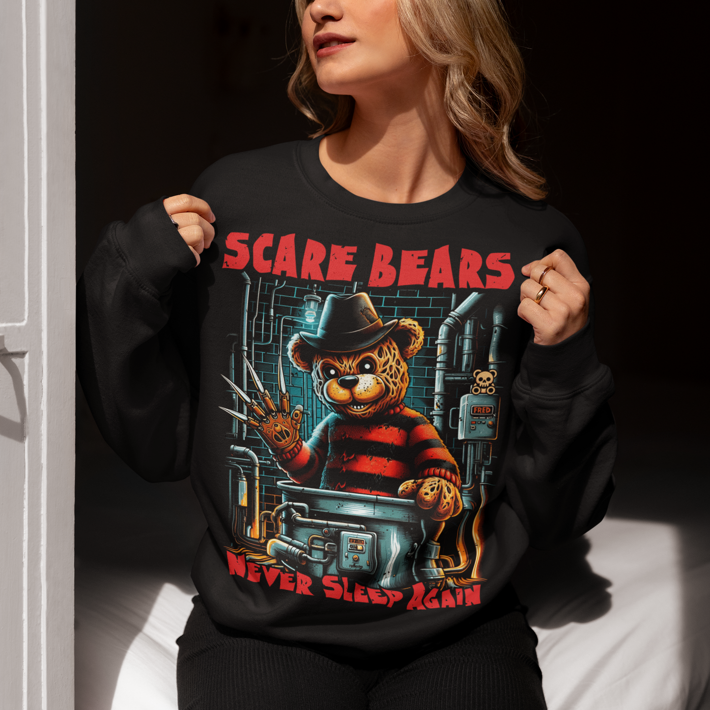 This Sweatshirt features a burnt, scary bear, wearing a tattered hat and a bladed glove, standing menacingly in a dark boiler room. The bear's charred fur and glowing red eyes give off a terrifying vibe, with steam pipes and sparks in the background. The bold text above reads "SCARE BEARS", and the chilling tagline below says "NEVER SLEEP AGAIN", adding to the sinister atmosphere. Perfect for fans of horror and twisted takes on childhood icons.