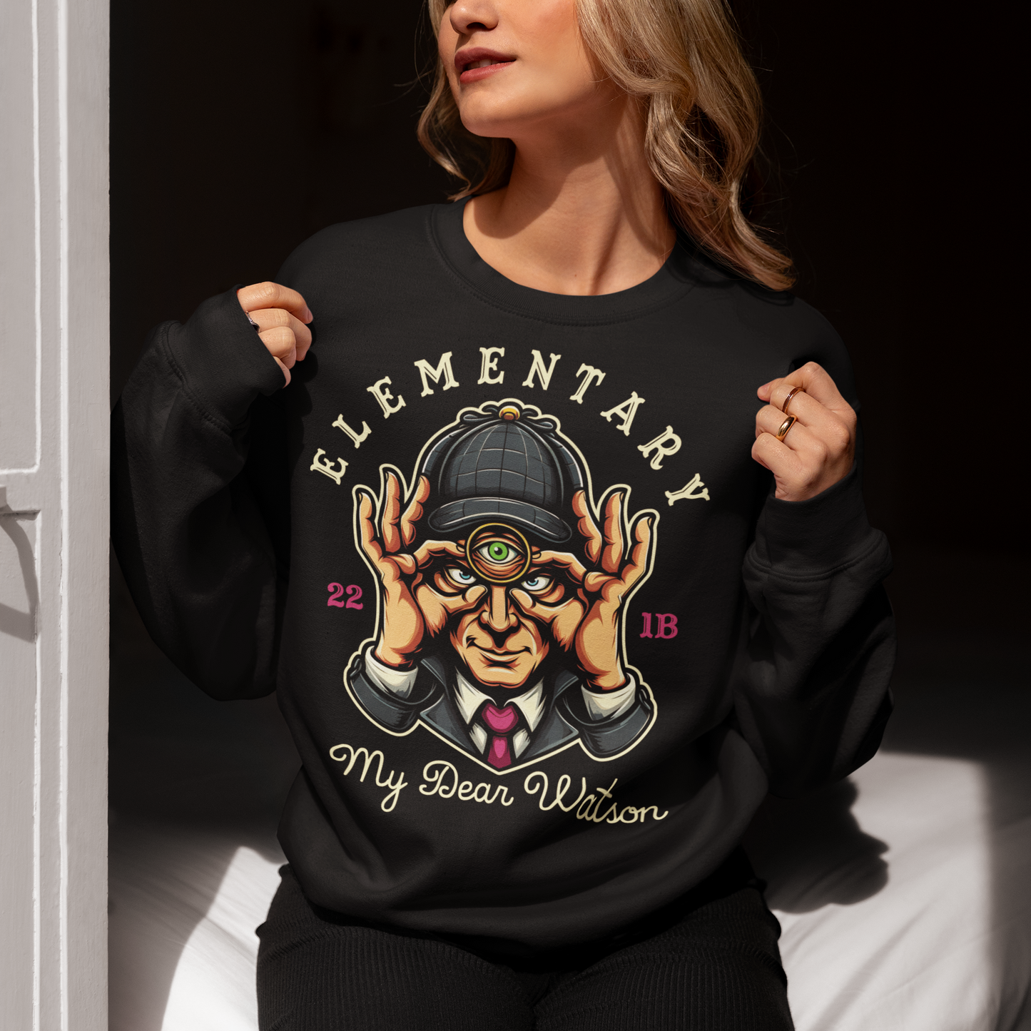 Unlock the mysteries of the mind with our unique Sherlock Holmes inspired sweatshirt. Featuring the iconic detective with a third eye, symbolizing his unparalleled powers of observation and deduction. With a steely gaze and a mind sharper than any blade, this rendition of Holmes exudes intellect and intrigue. Emblazoned with the timeless phrase 'ELEMENTARY MY DEAR WATSON', this shirt is a nod to Holmes' famous catchphrase, capturing his wit and astuteness in every wear.