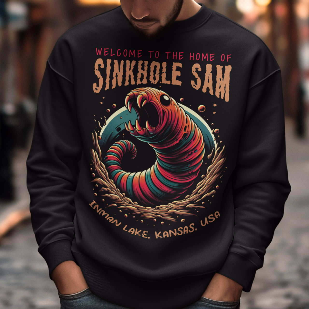 Unleash your inner cryptid enthusiast with our exclusive Sinkhole Sam Sweatshirt! This shirt features a bold, vibrant graphic of the legendary creature from Kansas folklore, brought to life in stunning detail. Sinkhole Sam, the elusive serpent-like beast rumored to inhabit the deep waters of Inman Lake, is depicted in a dramatic, eye-catching design that captures the mystery and excitement of this local legend.
