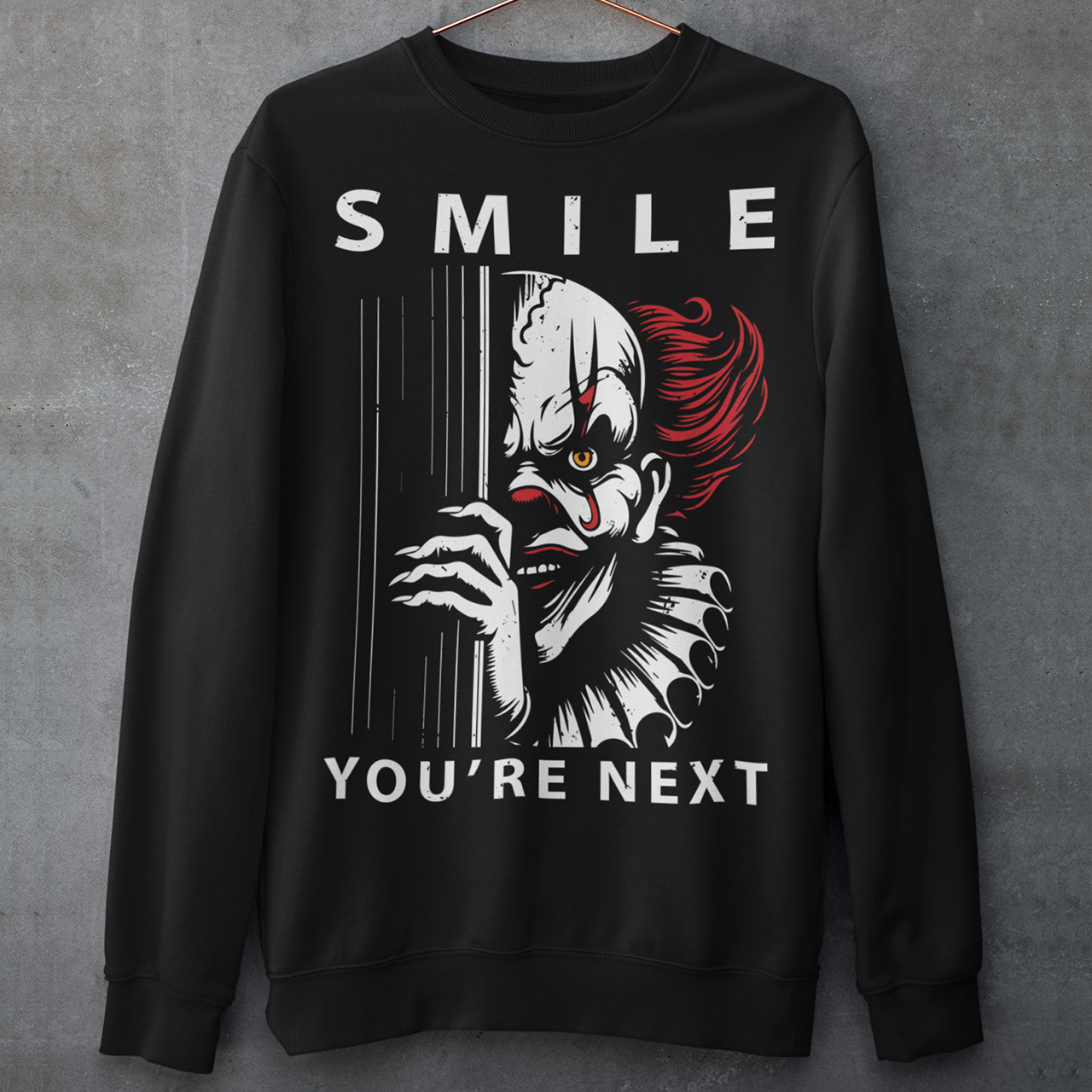 Introducing our chillingly captivating sweatshirt design, "SMILE YOU'RE NEXT." This bone-chilling masterpiece features a sinister, grinning killer clown, designed to send shivers down your spine. The intricate details of the clown's malevolent expression are both mesmerizing and haunting, drawing you into the depths of its dark persona.