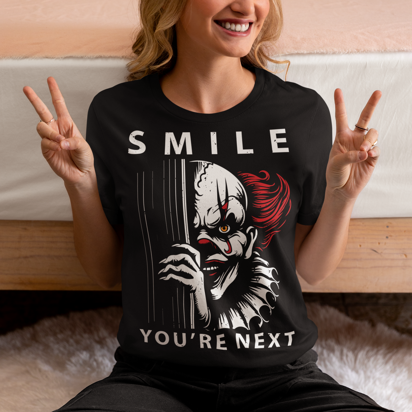 Introducing our chillingly captivating t-shirt design, "SMILE YOU'RE NEXT." This bone-chilling masterpiece features a sinister, grinning killer clown, designed to send shivers down your spine. The intricate details of the clown's malevolent expression are both mesmerizing and haunting, drawing you into the depths of its dark persona.
