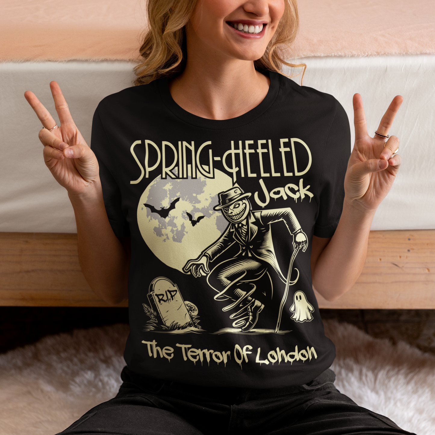 At the center of this striking t-shirt design stands Spring-heeled Jack, the enigmatic figure of Victorian urban legend. Rendered in bold lines and vibrant colors, Spring-heeled Jack exudes an air of mystery and menace. His elongated figure seems to leap from the fabric, his eyes gleaming with an otherworldly intensity.