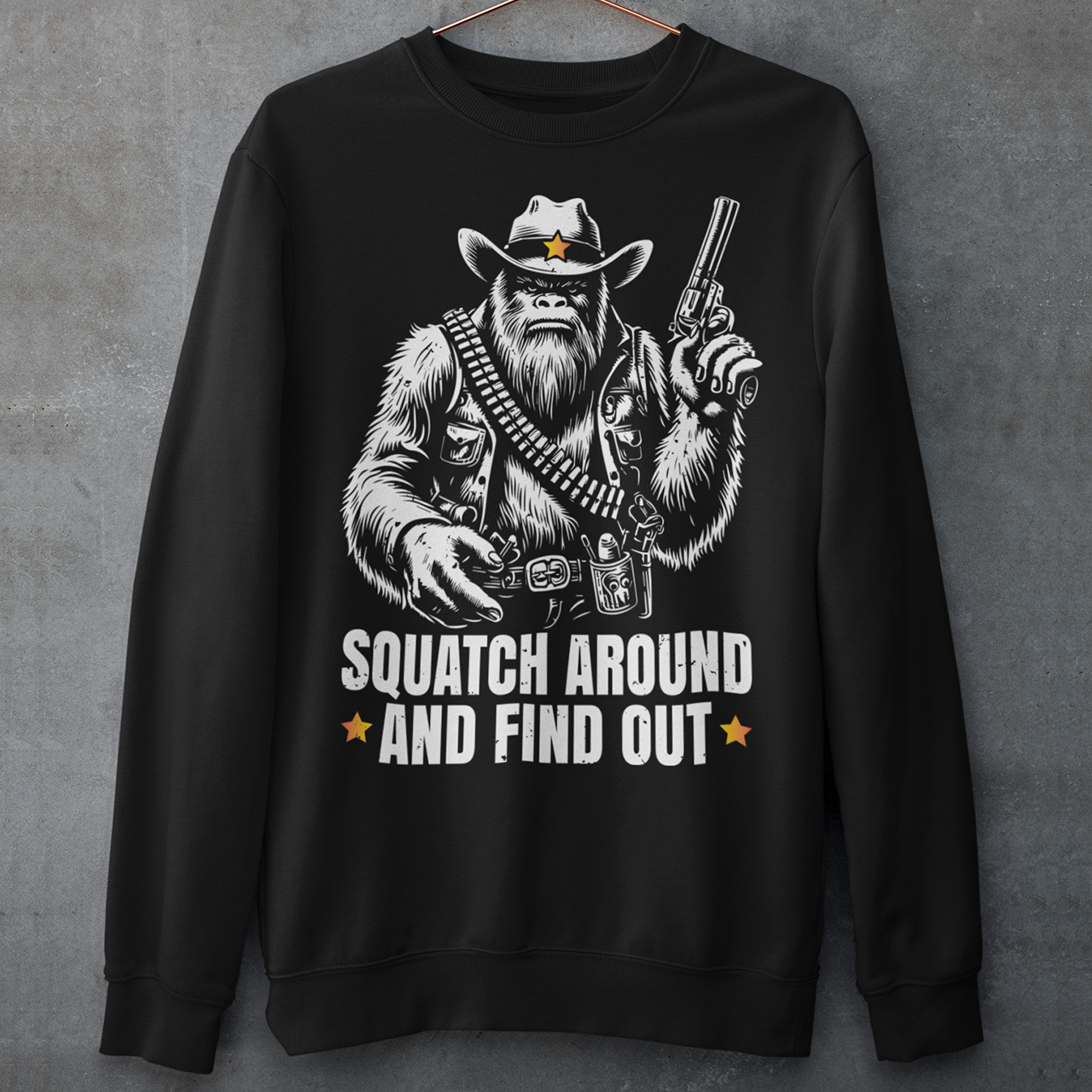 Introducing the "Squatch Around And Find Out" sweatshirt, where the legend of the wild west meets the mystery of the elusive Sasquatch! Picture this: a rugged, majestic Sasquatch, decked out in full cowboy gear, complete with a sheriff's badge and a trusty firearm at the ready. With a steely gaze and an air of authority, this Squatch means business. Beneath this formidable figure, the bold text reads: "SQUATCH AROUND AND FIND OUT."