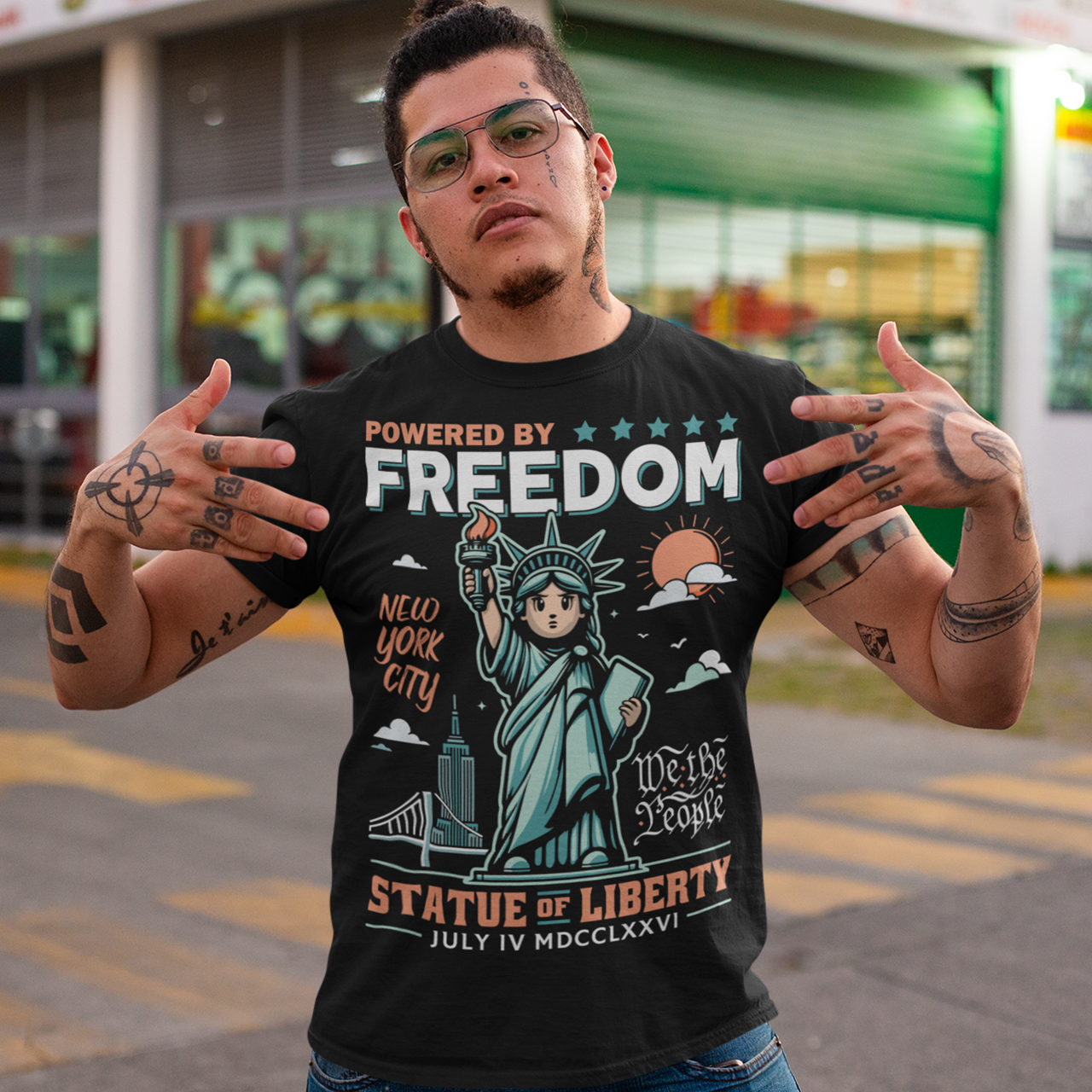 This tee features a bold cartoon rendition of the Statue of Liberty—full of attitude and charm—striking a heroic pose with a torch blazing high. Above her, the slogan "POWERED BY FREEDOM" pops in all-caps, making a loud and proud statement. This shirt is perfect for anyone who believes freedom isn't just a right—it's a superpower. Great for July 4th, rallies, or just everyday rebel energy.