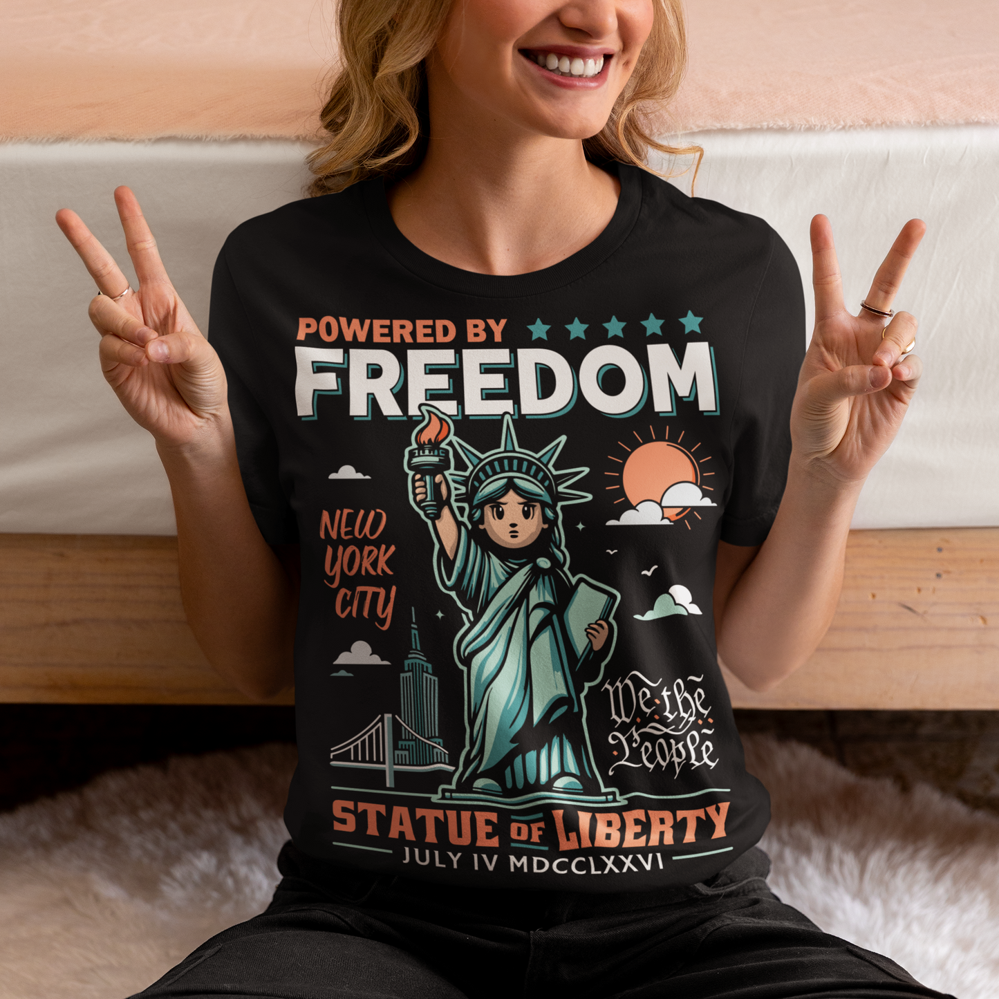 This tee features a bold cartoon rendition of the Statue of Liberty—full of attitude and charm—striking a heroic pose with a torch blazing high. Above her, the slogan "POWERED BY FREEDOM" pops in all-caps, making a loud and proud statement. This shirt is perfect for anyone who believes freedom isn't just a right—it's a superpower. Great for July 4th, rallies, or just everyday rebel energy.