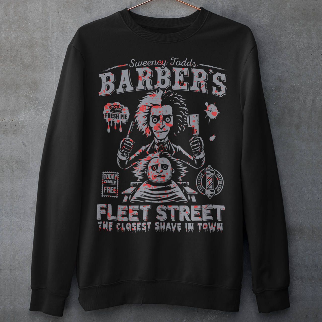 This bold shirt pays tribute to Sweeney Todd’s Barber Shop, the infamous haunt of Fleet Street. The shirt captures the eerie charm of the Demon Barber himself. Perfect for theatre fans, horror enthusiasts, or anyone with a taste for the macabre, this shirt is equal parts stylish and sinister.