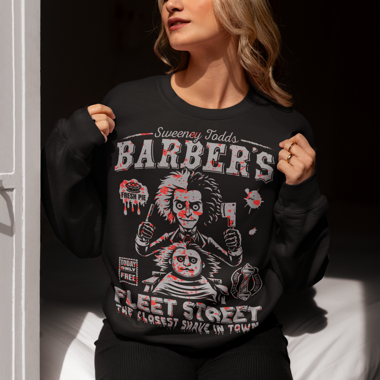 This bold shirt pays tribute to Sweeney Todd’s Barber Shop, the infamous haunt of Fleet Street. The shirt captures the eerie charm of the Demon Barber himself. Perfect for theatre fans, horror enthusiasts, or anyone with a taste for the macabre, this shirt is equal parts stylish and sinister.