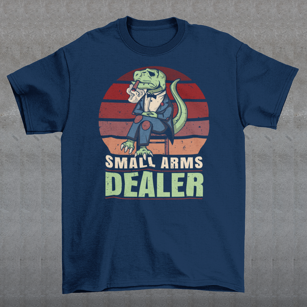 Introducing our one-of-a-kind "Small Arms Dealer" T-shirt, a roaring blend of prehistoric power and modern-day swagger! This tee showcases a whimsical and unforgettable design that's sure to turn heads and spark conversations.
In the heart of the Cretaceous era, meet our mafia T-Rex, dressed to impress in a sleek, pinstriped suit. With a cigar perched confidently between his tiny T-Rex teeth, he exudes an air of authority and a touch of humor.