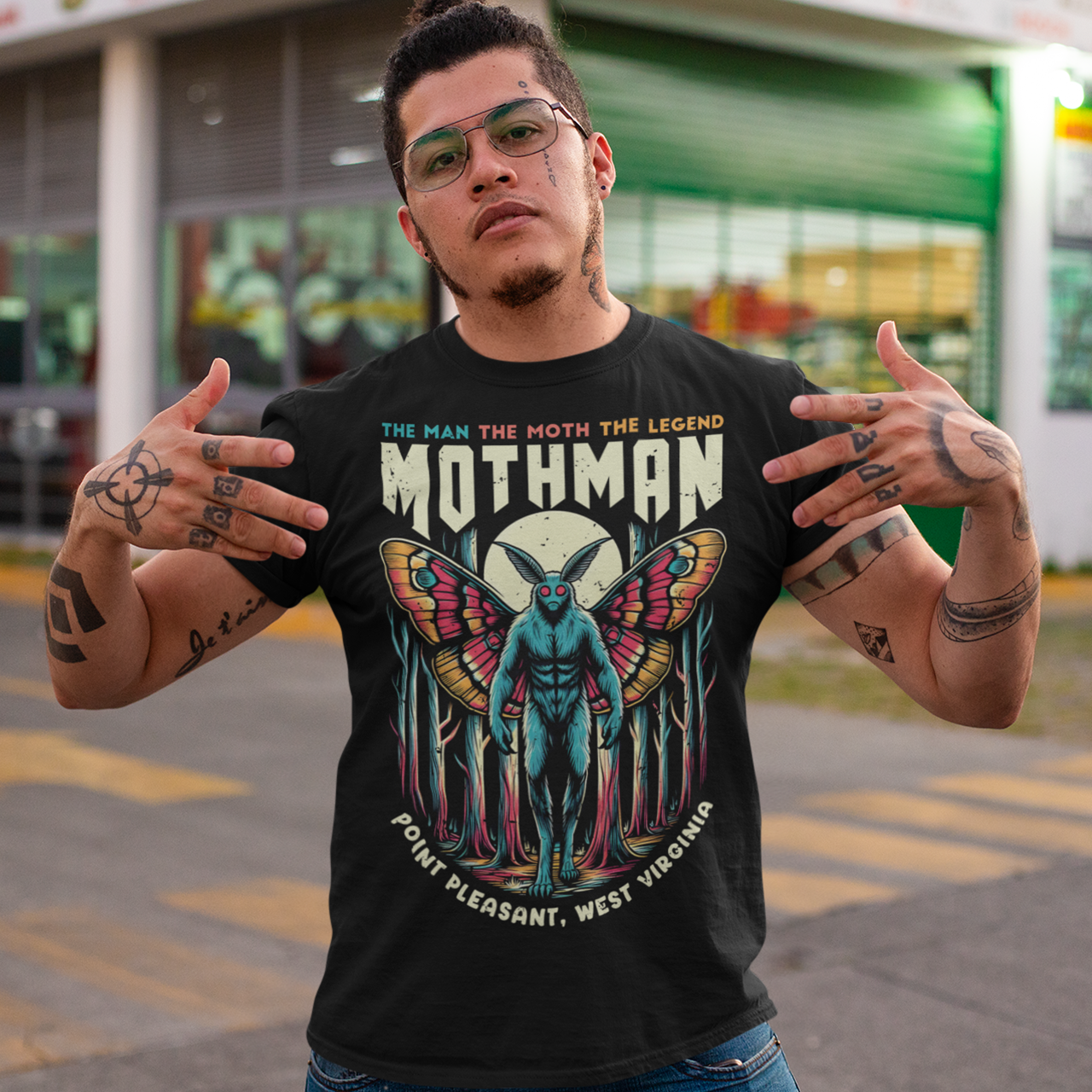 Introducing our exclusive Mothman t-shirt, perfect for fans of cryptid lore and mysterious legends! This shirt features a striking design of the legendary Mothman lurking in a dense, moonlit forest. His glowing red eyes peer through the trees, capturing the eerie essence of the famed creature. Above the haunting image, bold text declares: "THE MAN THE MOTH THE LEGEND MOTHMAN," paying homage to the enigmatic figure who has intrigued generations.