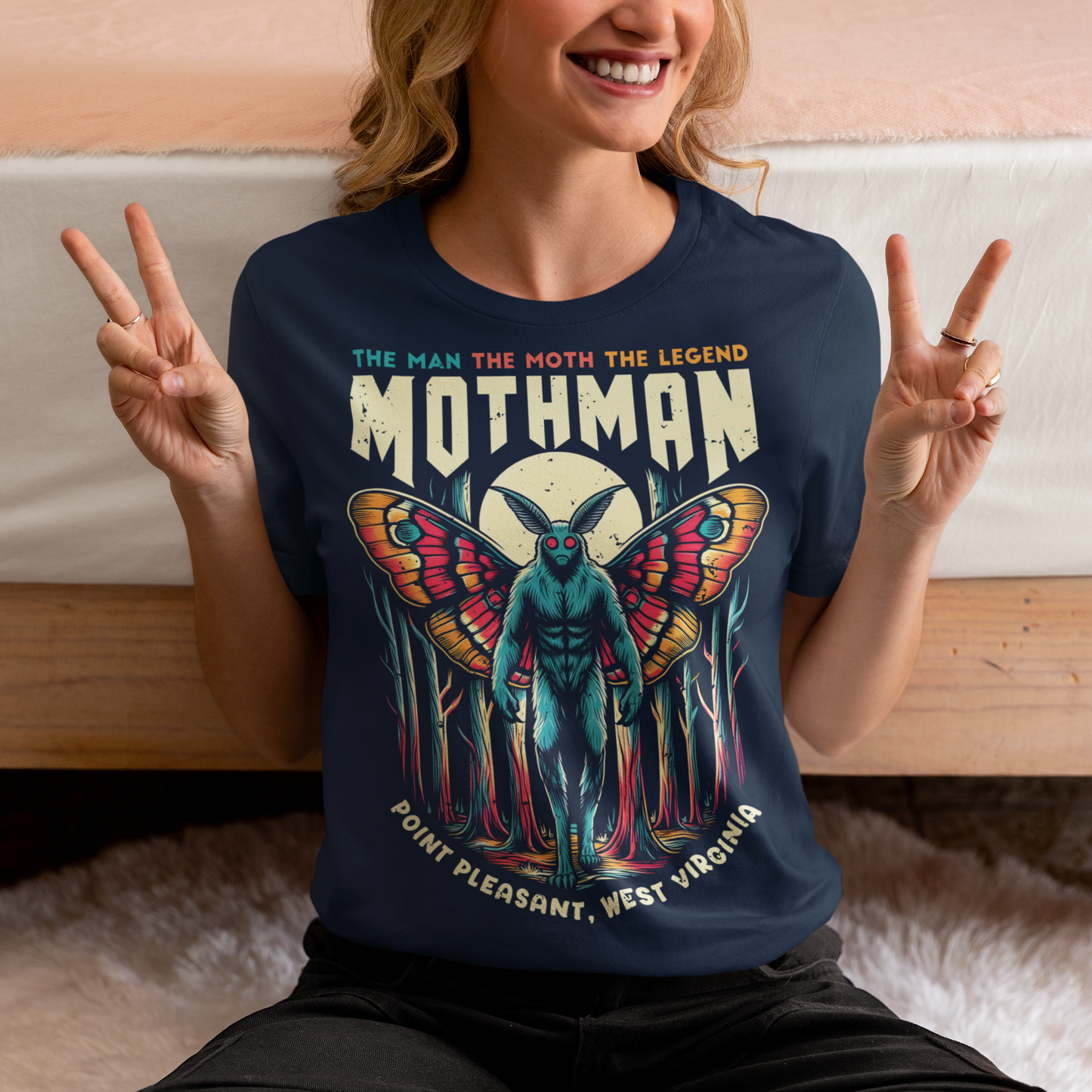 Introducing our exclusive Mothman t-shirt, perfect for fans of cryptid lore and mysterious legends! This shirt features a striking design of the legendary Mothman lurking in a dense, moonlit forest. His glowing red eyes peer through the trees, capturing the eerie essence of the famed creature. Above the haunting image, bold text declares: "THE MAN THE MOTH THE LEGEND MOTHMAN," paying homage to the enigmatic figure who has intrigued generations.