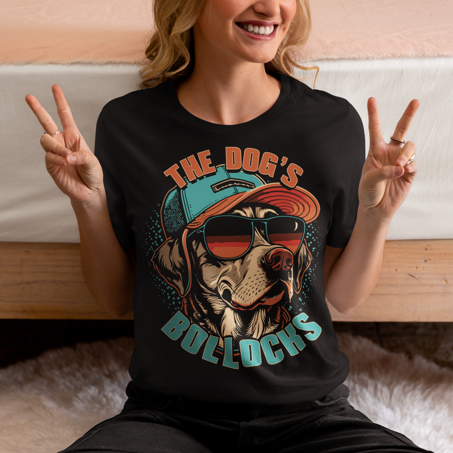 Introducing our funky and hilarious t-shirt featuring a cool canine companion who's ready to take the fashion world by storm. This attention-grabbing design showcases a lovable dog wearing a stylish cap and trendy sunglasses. With an air of confidence and undeniable charm, this pup is sure to turn heads wherever you go. Emblazoned across the front of the shirt, you'll find the bold and cheeky text "THE DOG'S BOLLOCKS." It's a witty nod to the dog's confident demeanor and undeniable swagger.