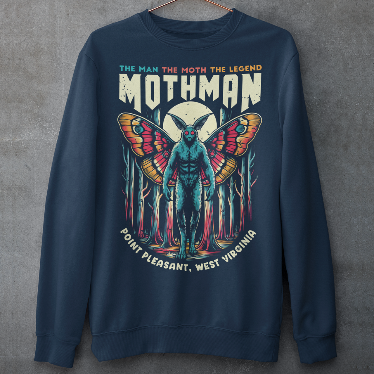 Navy sweatshirt of Mothman in a forest with text above THE MAN THE MOTH THE LEGEND MOTHMAN.