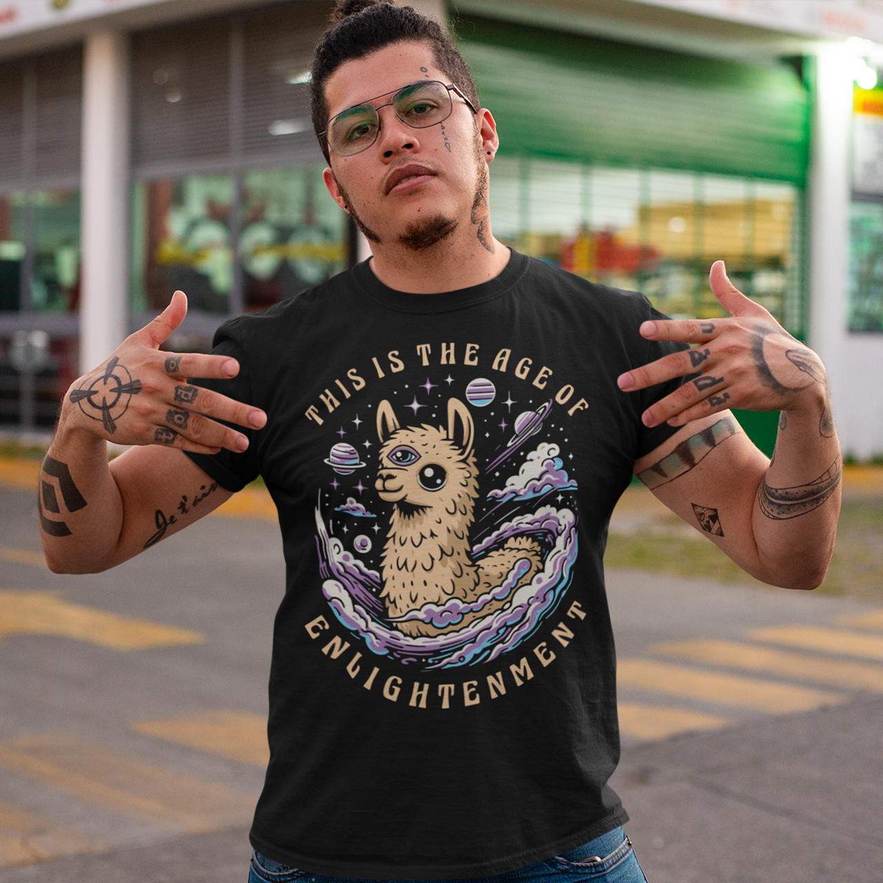 Embrace cosmic wisdom with our captivating Llama t-shirt! Picture this: amidst the vast expanse of space, a serene Llama gazes into the universe, its third eye gleaming with enlightenment. With swirling galaxies as its backdrop, this design captures the essence of transcendence and insight. Around the celestial spectacle, bold text declares, 'THIS IS THE AGE OF ENLIGHTENMENT,' heralding a new era of awareness and understanding.