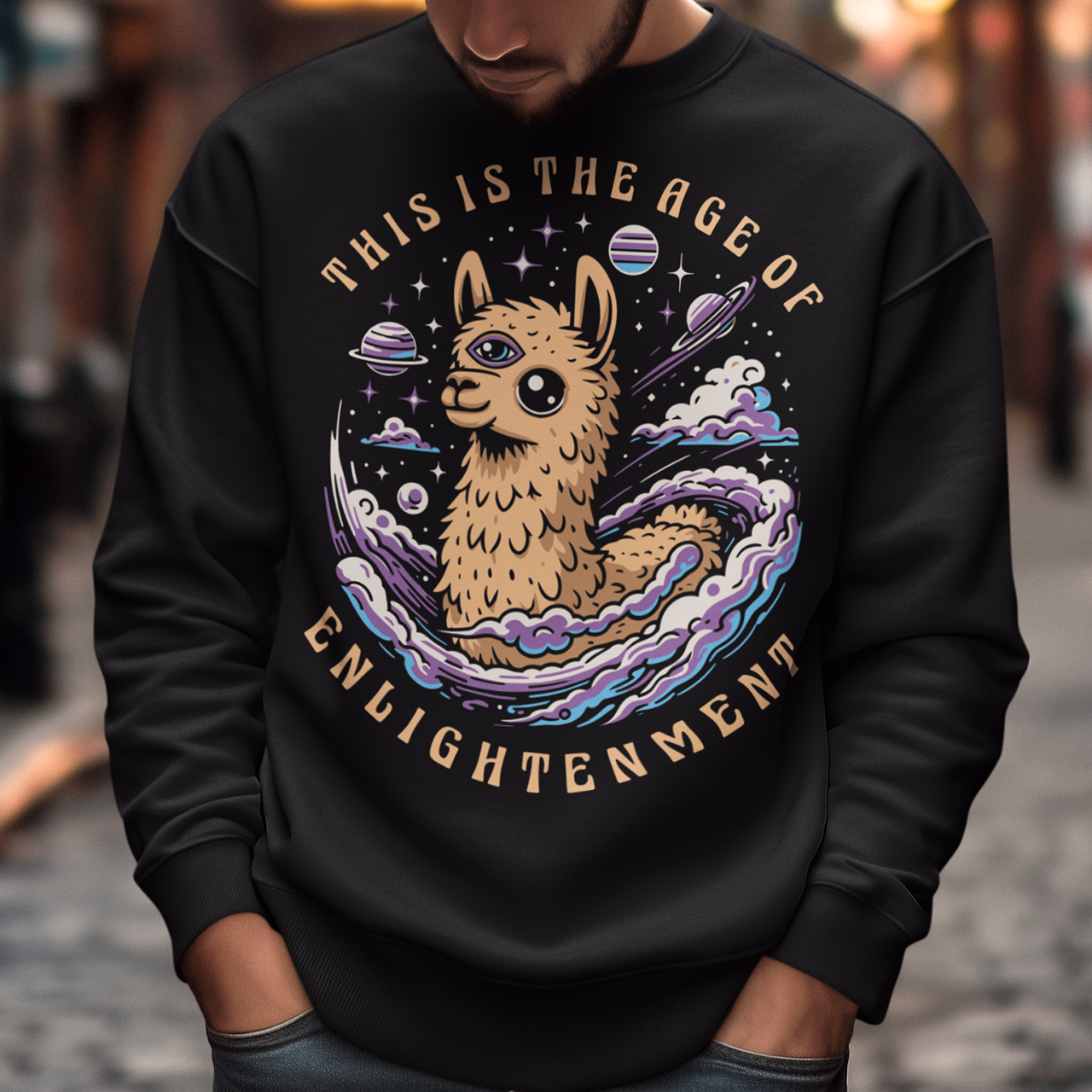 Embrace cosmic wisdom with our captivating Llama sweatshirt! Picture this: amidst the vast expanse of space, a serene Llama gazes into the universe, its third eye gleaming with enlightenment. With swirling galaxies as its backdrop, this design captures the essence of transcendence and insight. Around the celestial spectacle, bold text declares, 'THIS IS THE AGE OF ENLIGHTENMENT,' heralding a new era of awareness and understanding.