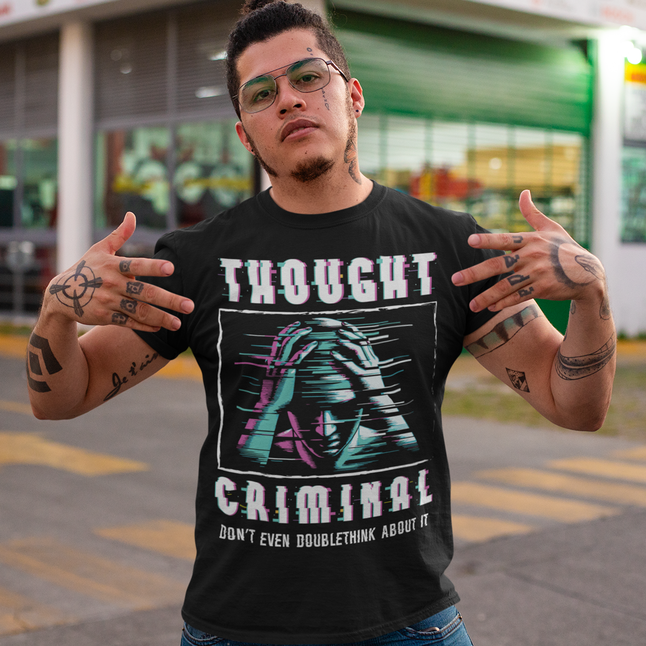 This bold and edgy T-shirt features the phrase "THOUGHT CRIMINAL" in a glitched, distorted font, giving it a rebellious, cyberpunk-inspired aesthetic. The design evokes themes of censorship, free thought, and dystopian resistance, making it perfect for those who challenge the status quo. Whether you're a fan of cyberpunk, retro-futurism, or just love thought-provoking designs, this tee is sure to turn heads.