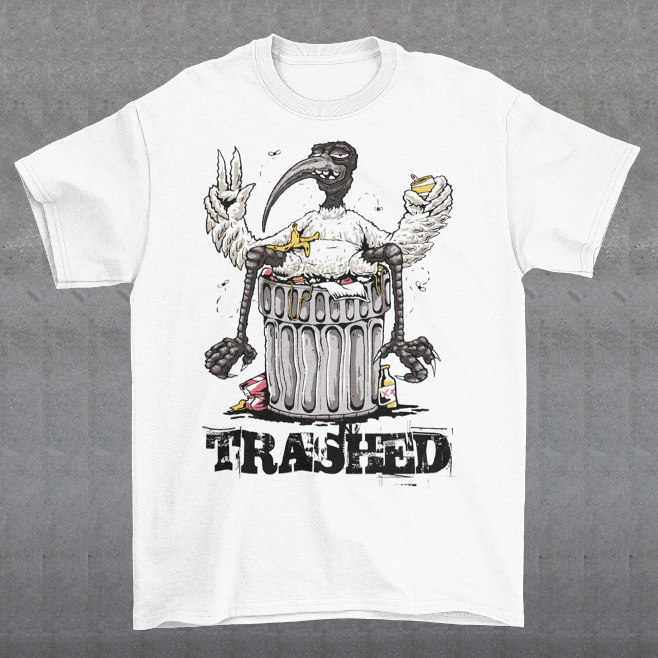 Introducing our latest t-shirt design, featuring a bird lying on a trash can with the text "TRASHED" emblazoned on bottom. This eye-catching design perfectly captures the nonchalant attitude of our feathered friend as it lounges atop a heap of discarded items. Whether you're looking to make a bold statement or simply appreciate the humor in the design, this "TRASHED" t-shirt is sure to turn heads and spark conversations. So why wait? Add it to your wardrobe today and let your style take flight!