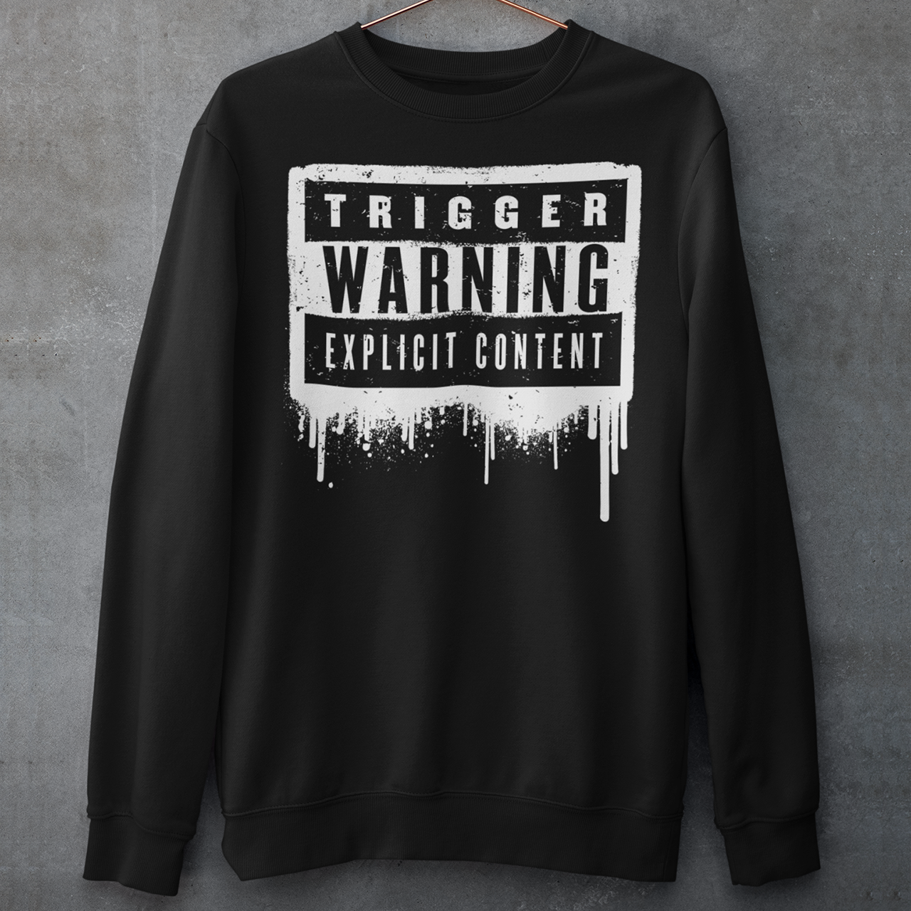 This sweatshirt features a bold paint design with the words "Trigger Warning" and "Explicit Content". The message is clear and direct, warning others that the content may be disturbing or offensive.
