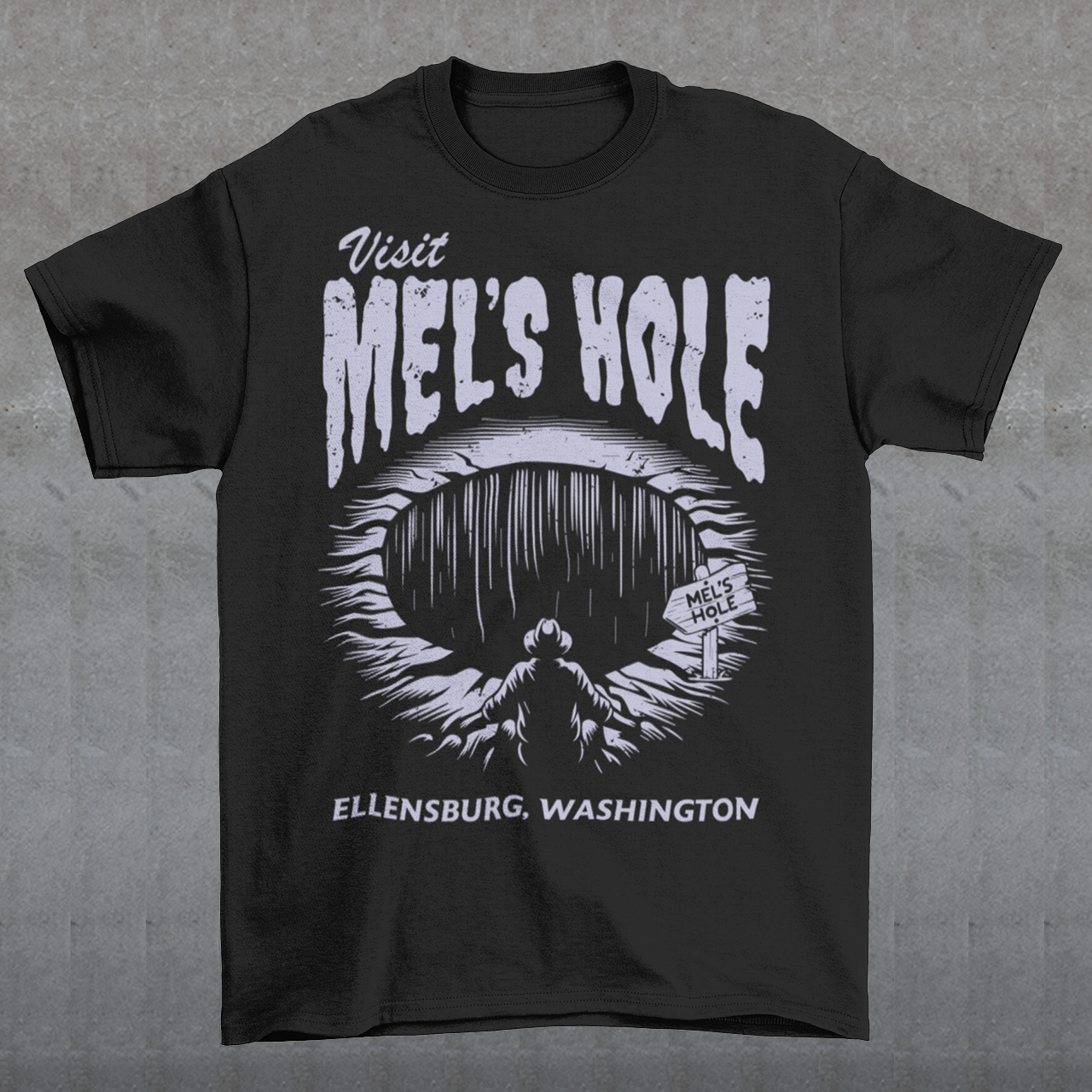 Step into the strange with this quirky and mysterious tee! Featuring a bold illustration of a curious man peering into a dark, bottomless abyss, this shirt pays homage to the legendary paranormal tale of Mel's Hole — a supposed infinite pit in the wilds of Washington State. The vintage-style artwork is topped with the eerie invitation: "VISIT MEL'S HOLE" in retro tourism font, blending humor, folklore, and a dash of the unexplained.