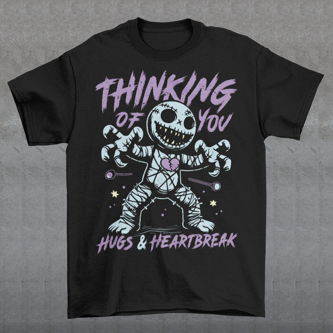 Dark humor meets twisted sweetness with this bold tee. Featuring a stitched-up voodoo doll at the center, the design captures that perfect mix of love and pain. Above the doll, the phrase “THINKING OF YOU” adds a playful sting, while below, “HUGS & HEARTBREAK” ties it all together with equal parts irony and affection. Perfect for anyone who loves edgy, alternative fashion—or just wants to send a cheeky message without saying a word.